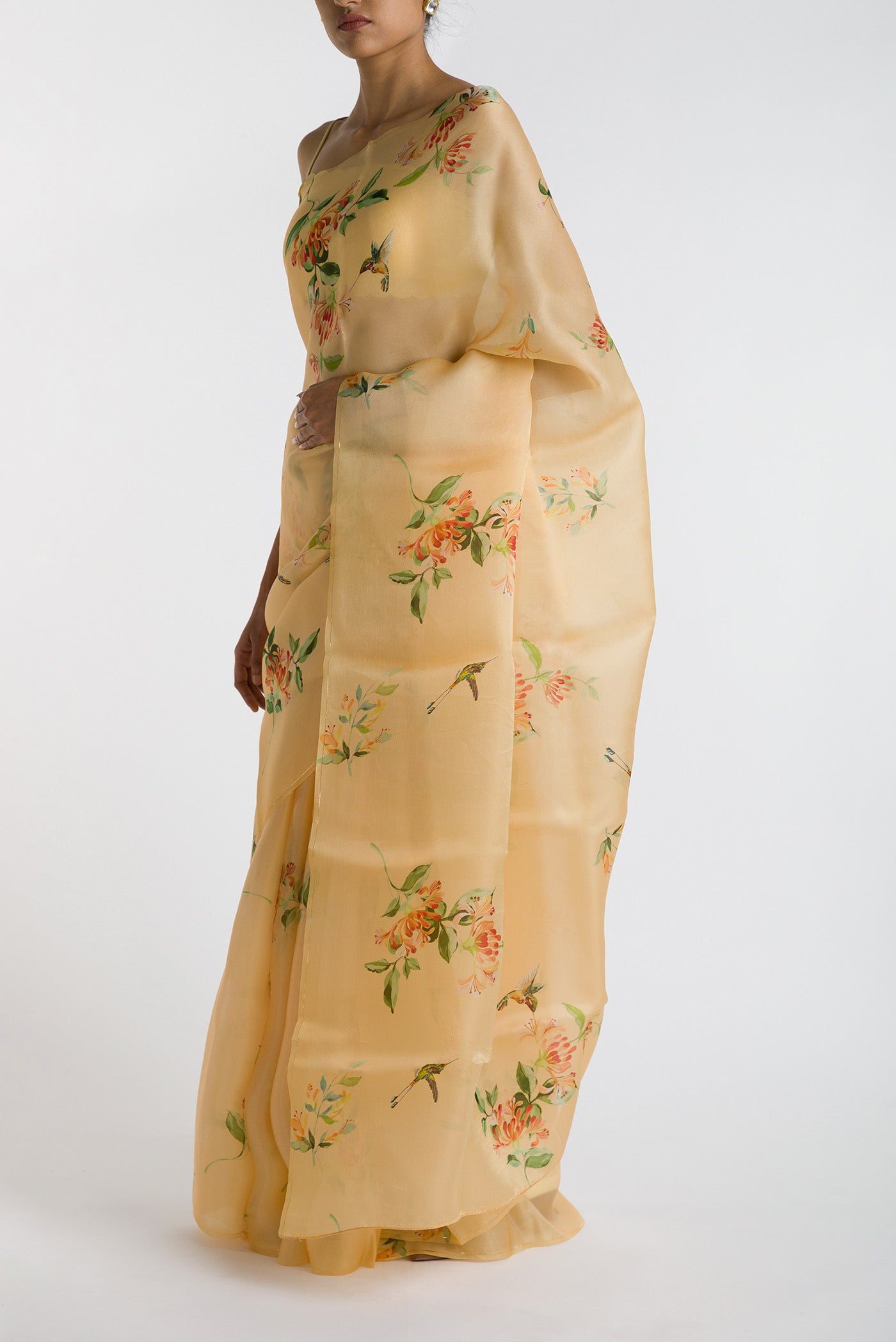 Close up image of the blouse of Yellow Satin Organza Saree with Bird Print on the body and Without Border