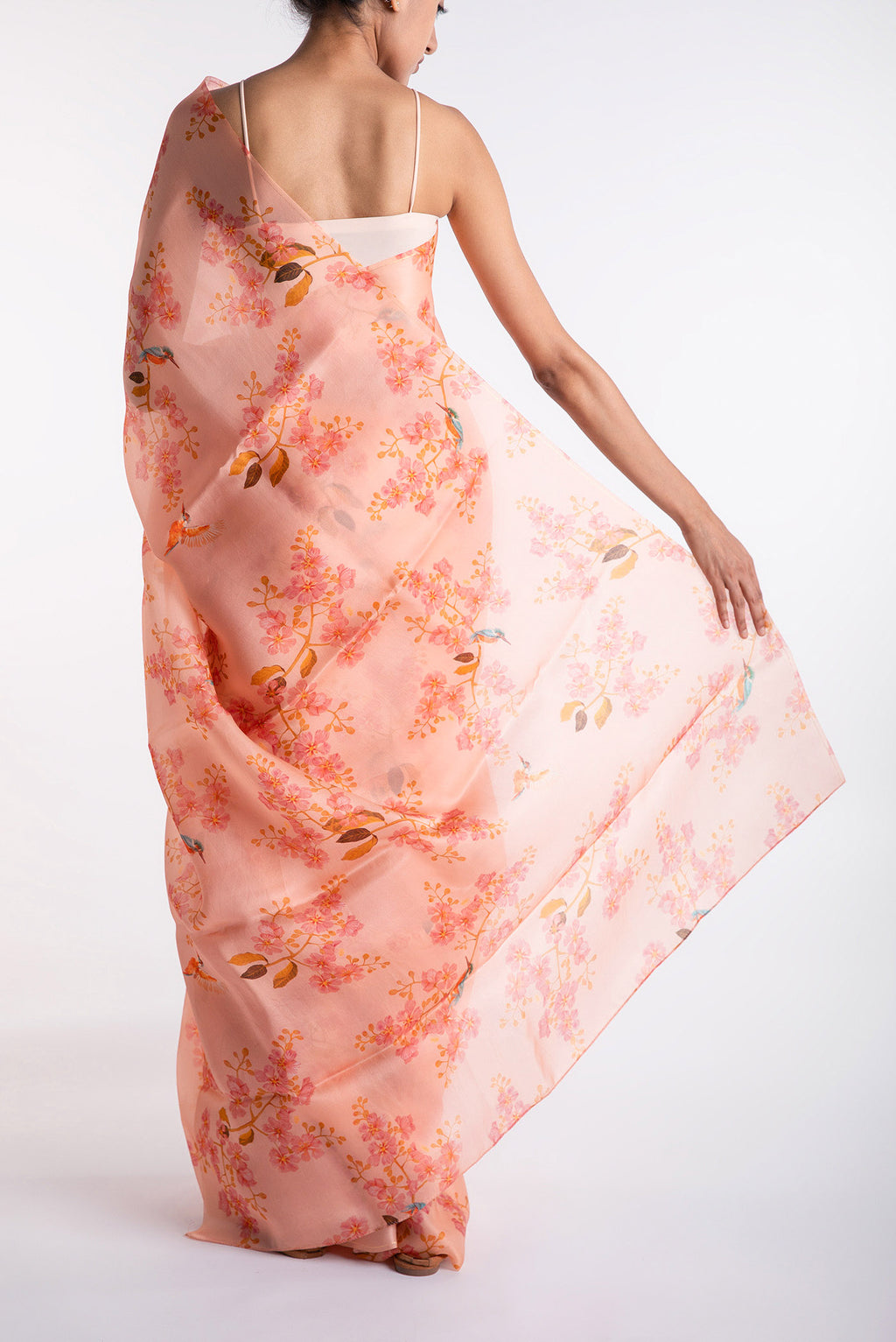 Pleats and pallu of Peach Satin Organza Saree with Bird Print on the body and Without Border