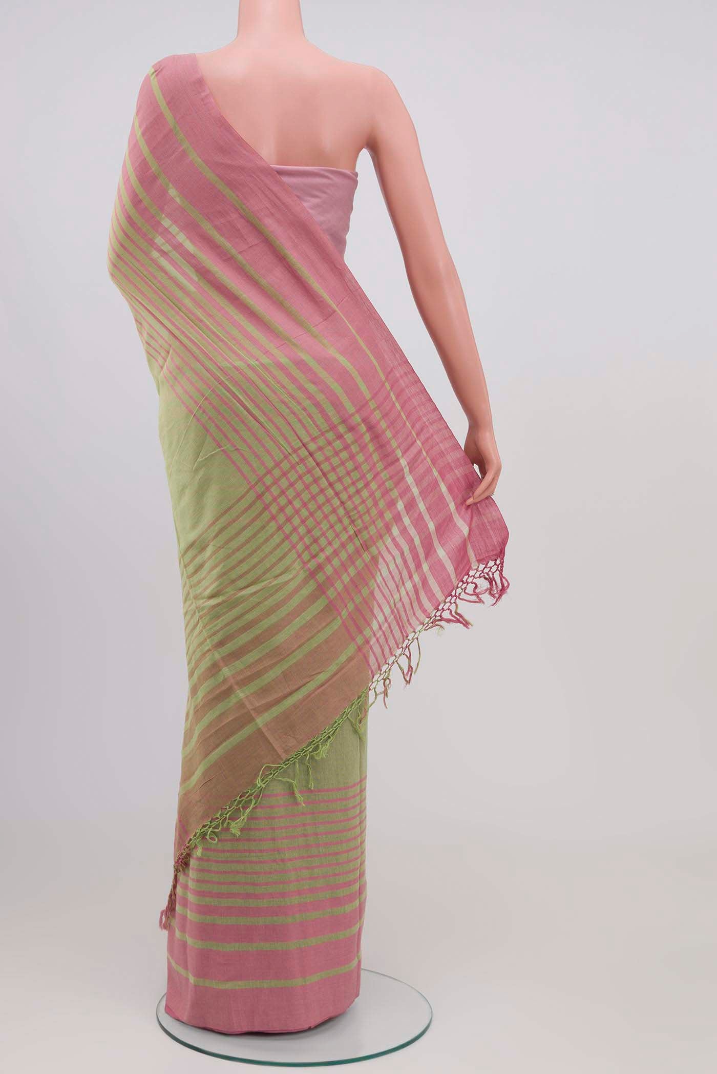 Pleats and pallu of Titli, framed with proportioned stripes that gradually narrow towards the body, bringing together a vibrant palette in harmony Where the border and pallu stripes meet, tiny checks appear, evoking abstract butterflies - delicate creatures of spring and summer The plain body offers soft contrast, allowing the colours to shine On the pallu, these stripes return as subtle checks, adding a light, balanced finish