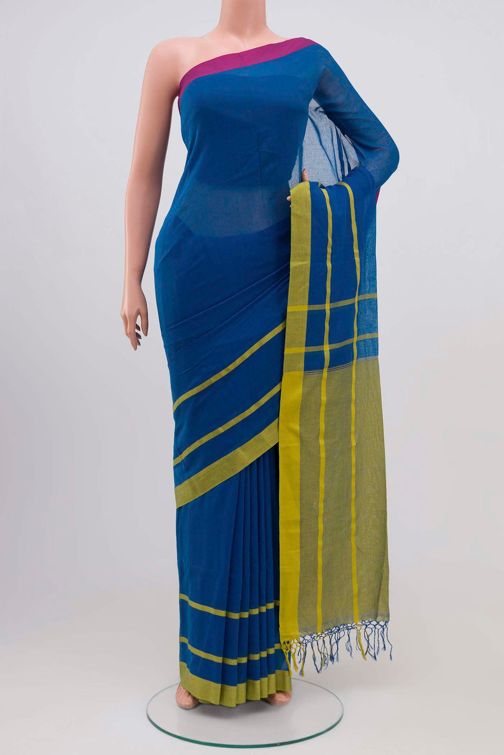 Chhaya, our Bengal cotton saree, draws inspiration from the clean, modern lines of Piet Mondrian A contrasting band forms the top border, creating a striking visual highlight across the body, while minimal stripes along the base and pallu introduce structure and balance Bold colour blocks reinterpret Chhaya, meaning shadow in Hindi, and the solid pallu completes the look with contemporary ease displayed on a mannequin