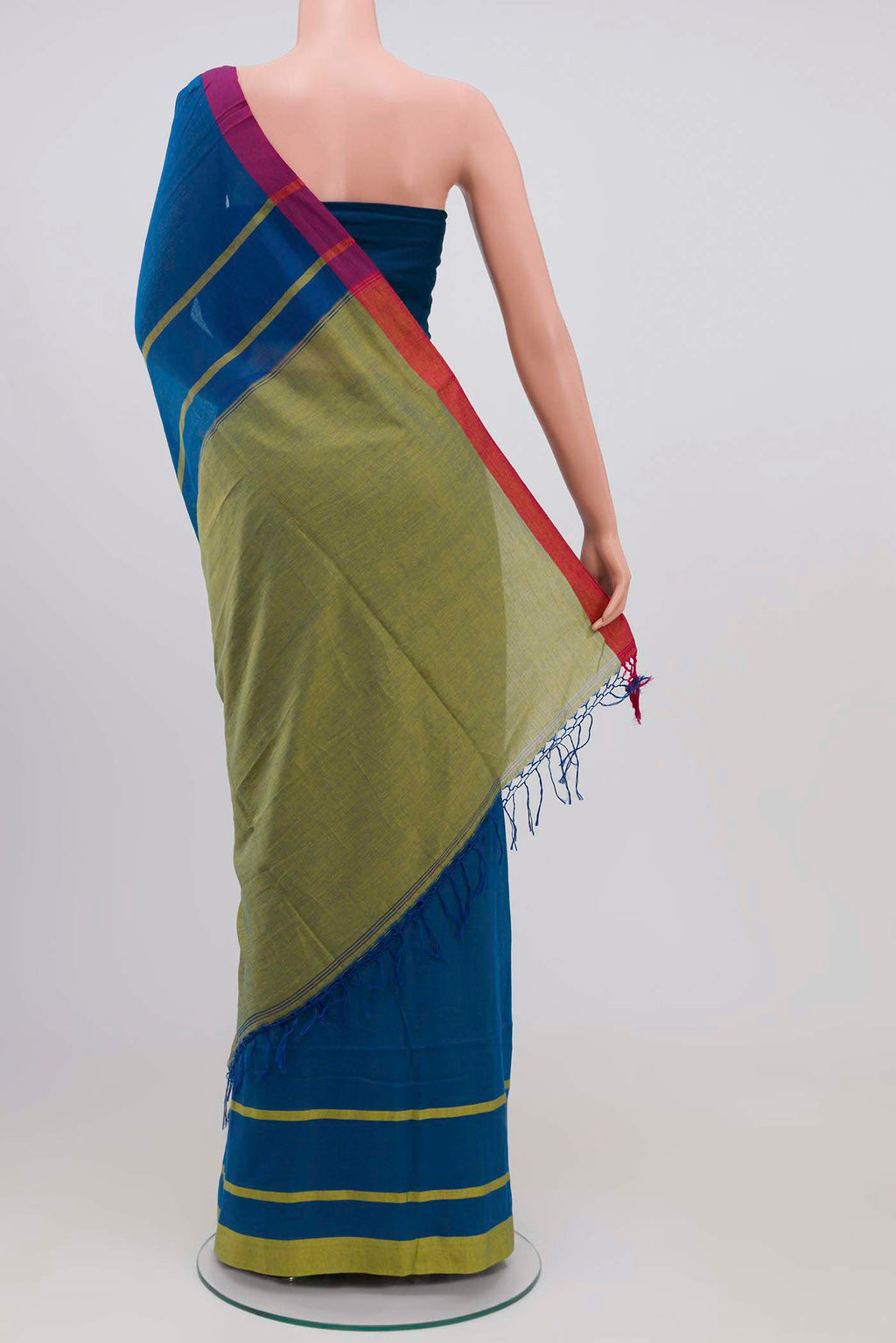 Pleats and pallu of Chhaya, our Bengal cotton saree, draws inspiration from the clean, modern lines of Piet Mondrian A contrasting band forms the top border, creating a striking visual highlight across the body, while minimal stripes along the base and pallu introduce structure and balance Bold colour blocks reinterpret Chhaya, meaning shadow in Hindi, and the solid pallu completes the look with contemporary ease