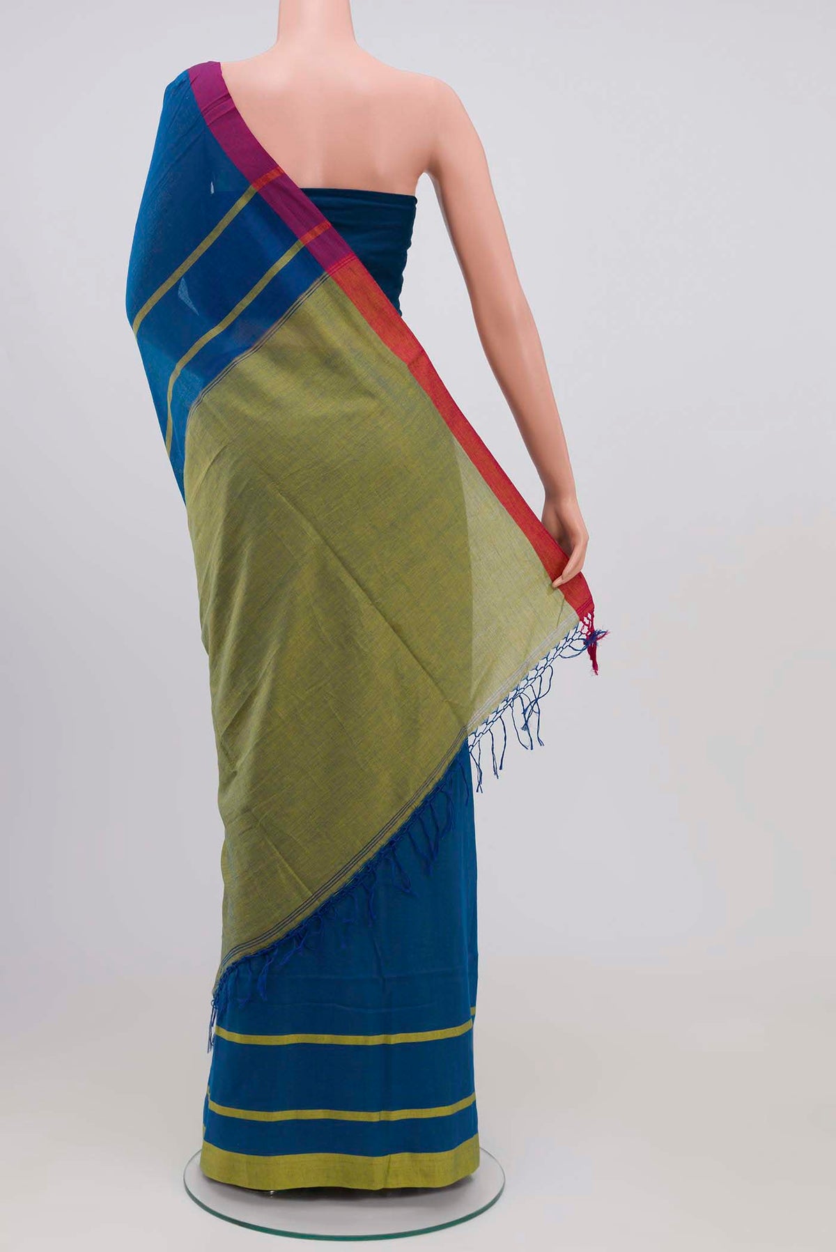 Pleats and pallu of Chhaya, our Bengal cotton saree, draws inspiration from the clean, modern lines of Piet Mondrian A contrasting band forms the top border, creating a striking visual highlight across the body, while minimal stripes along the base and pallu introduce structure and balance Bold colour blocks reinterpret Chhaya, meaning shadow in Hindi, and the solid pallu completes the look with contemporary ease