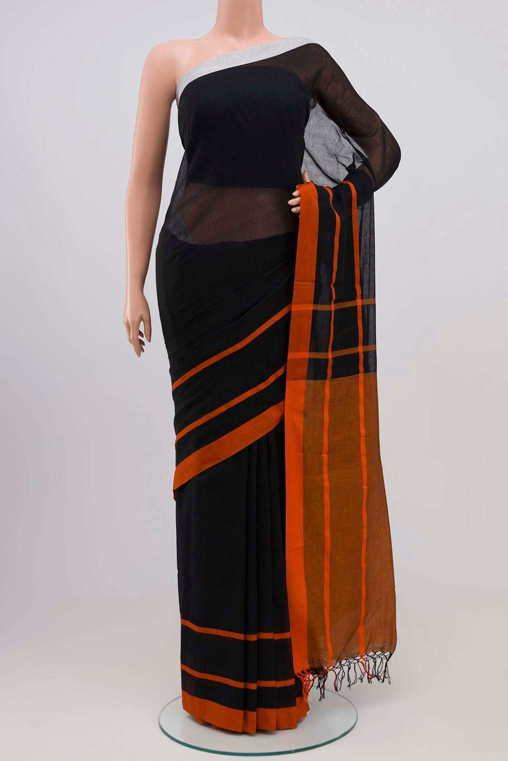 Chhaya, our Bengal cotton saree, draws inspiration from the clean, modern lines of Piet Mondrian A contrasting band forms the top border, creating a striking visual highlight across the body, while minimal stripes along the base and pallu introduce structure and balance Bold colour blocks reinterpret Chhaya, meaning shadow in Hindi, and the solid pallu completes the look with contemporary ease displayed on a mannequin