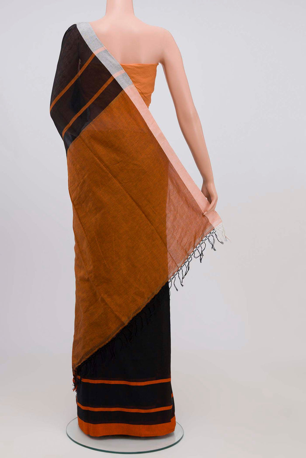 Pleats and pallu of Chhaya, our Bengal cotton saree, draws inspiration from the clean, modern lines of Piet Mondrian A contrasting band forms the top border, creating a striking visual highlight across the body, while minimal stripes along the base and pallu introduce structure and balance Bold colour blocks reinterpret Chhaya, meaning shadow in Hindi, and the solid pallu completes the look with contemporary ease