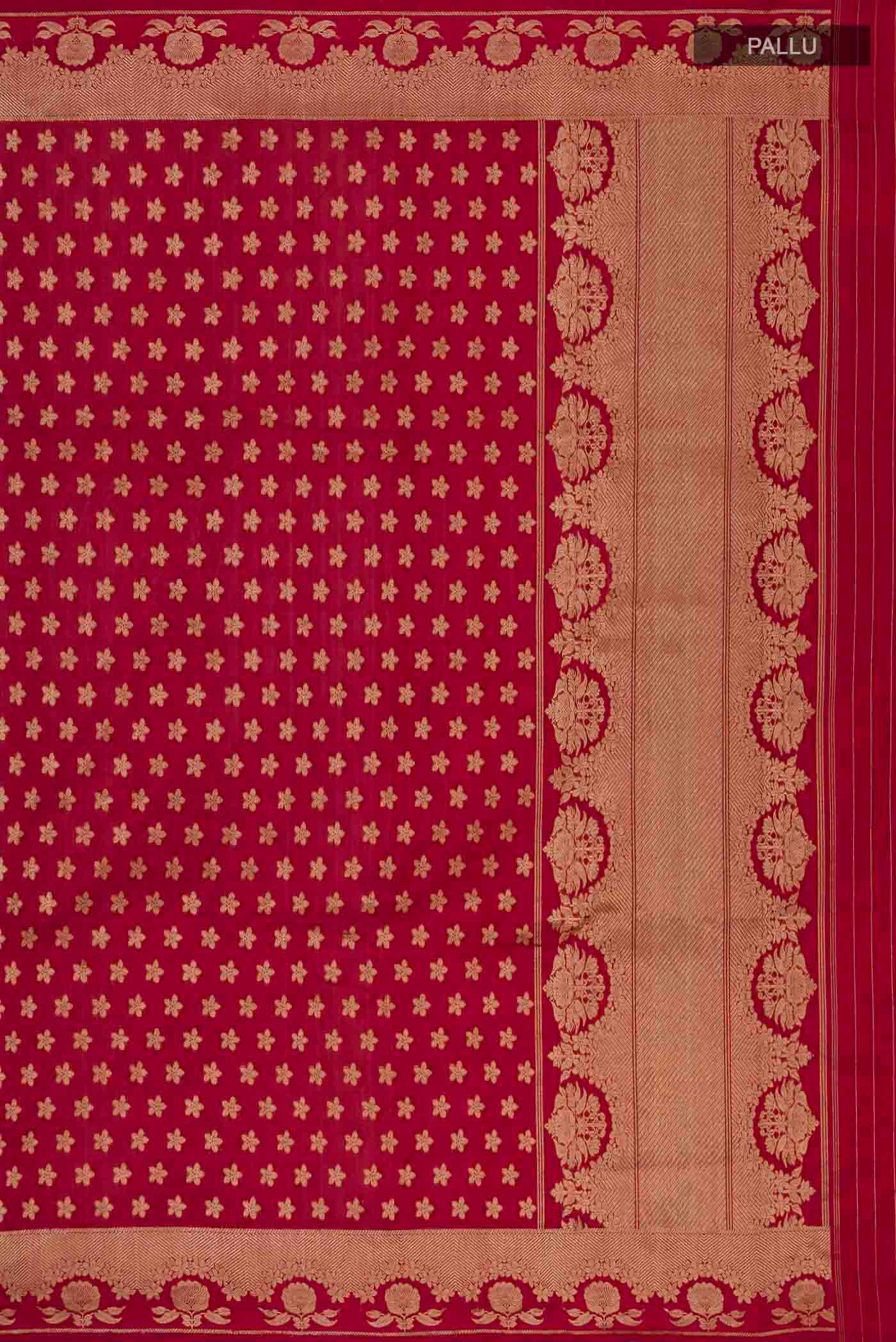 Close up image of the pallu of Maroon Banarasi Katan Silk Saree with Zari Butta on the body and Zari Border