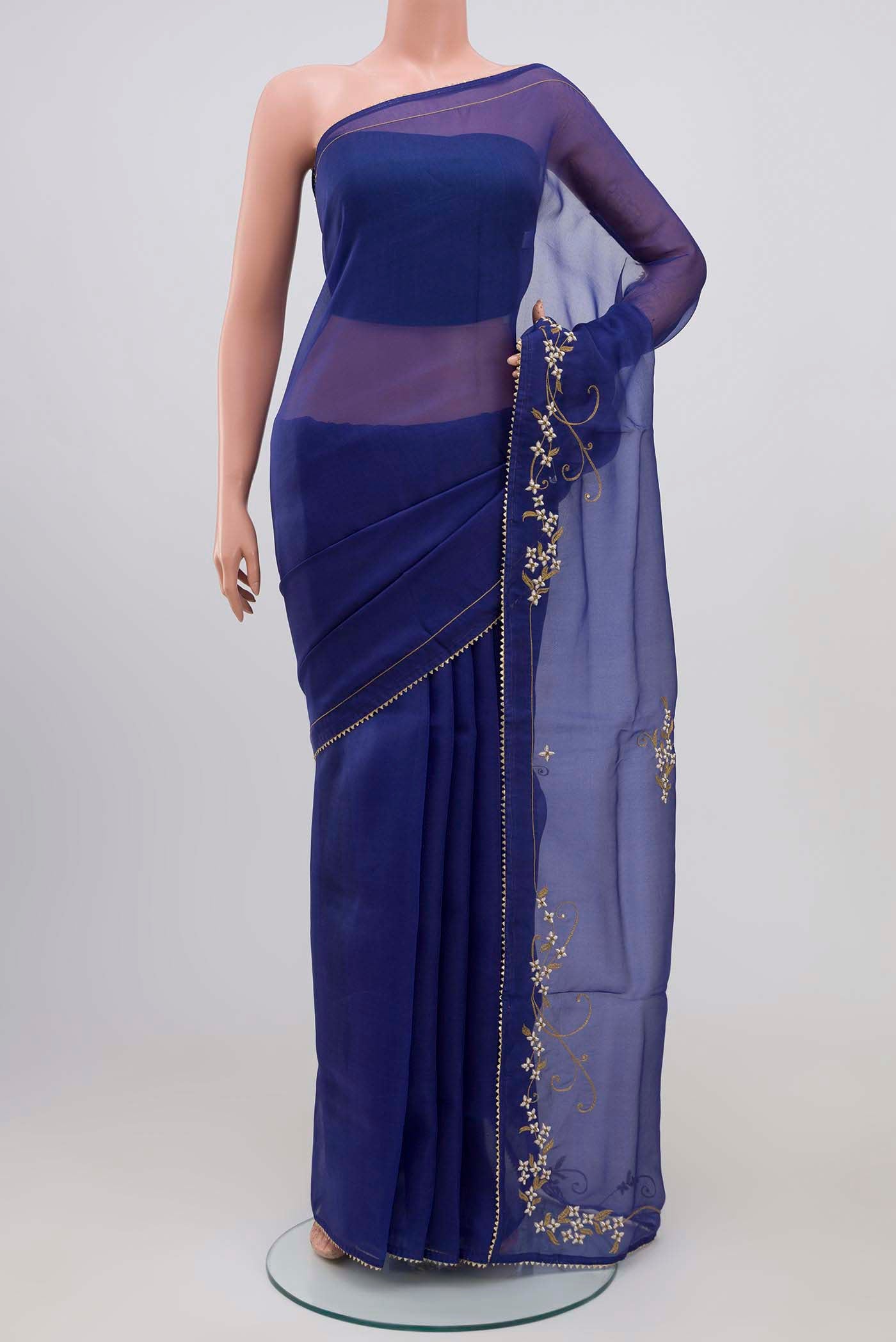 Blue Organza Silk Saree with Plain Body and Embroidery Border displayed on a mannequin