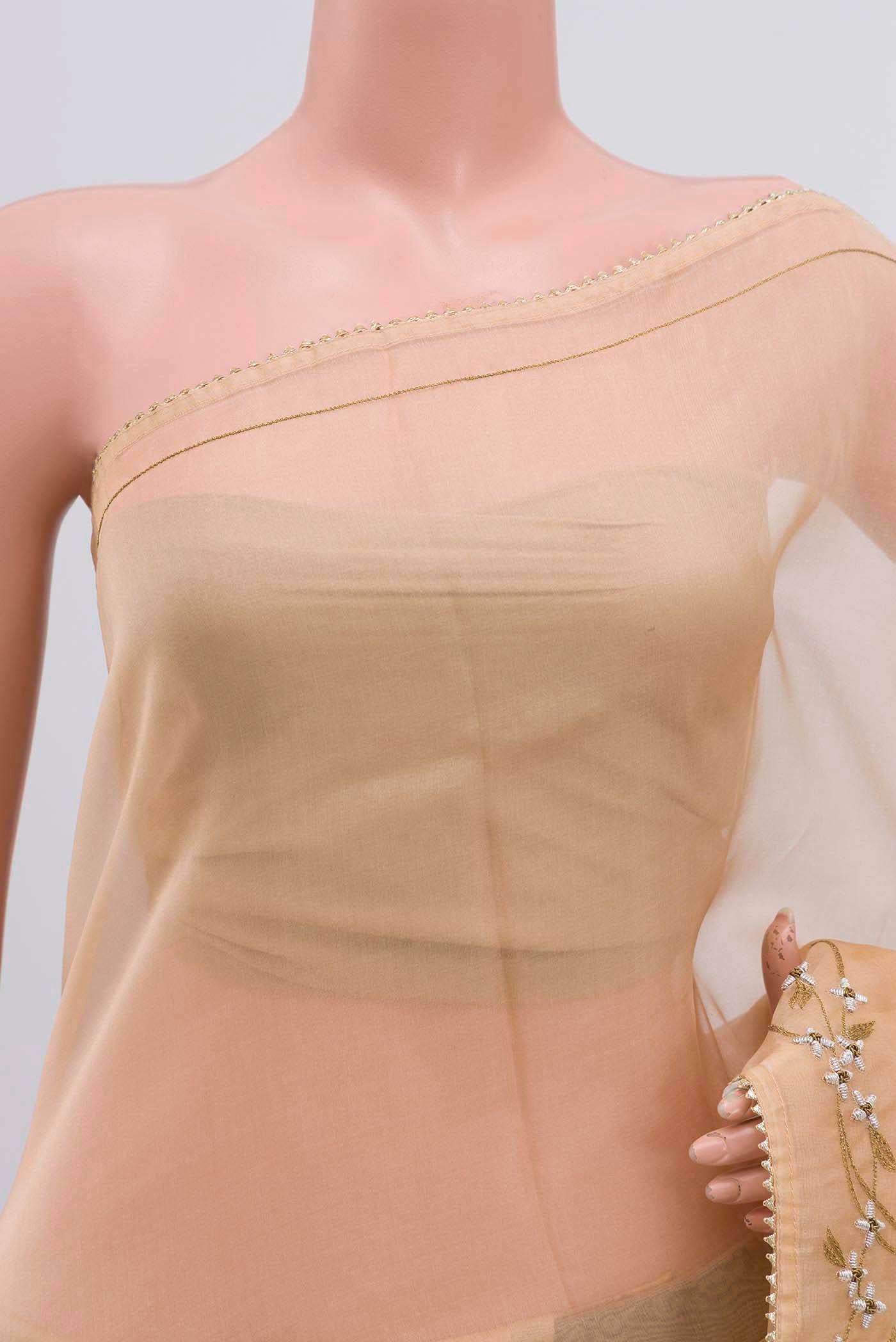 Close up of Sandal Organza Silk Saree with Plain Body and Embroidery Border displaying folds