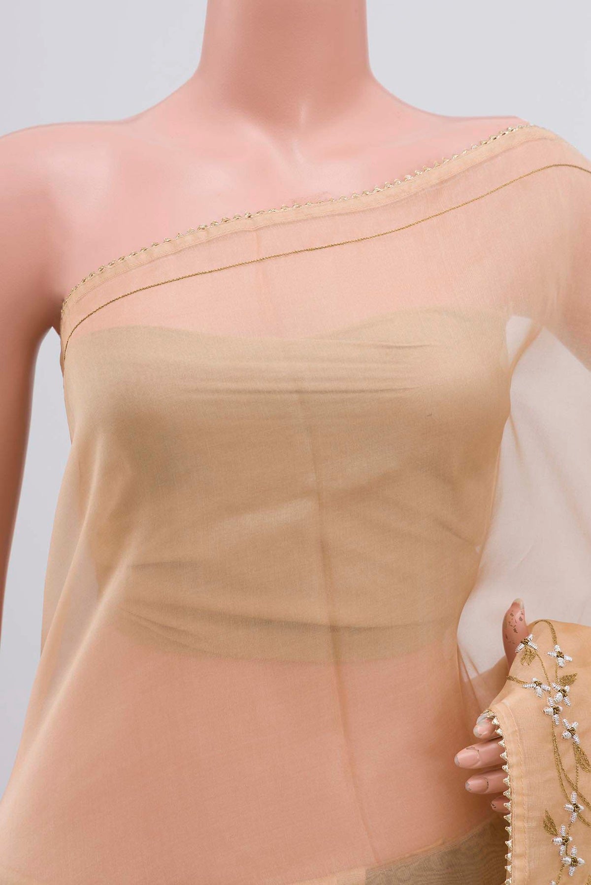 Close up of Sandal Organza Silk Saree with Plain Body and Embroidery Border displaying folds