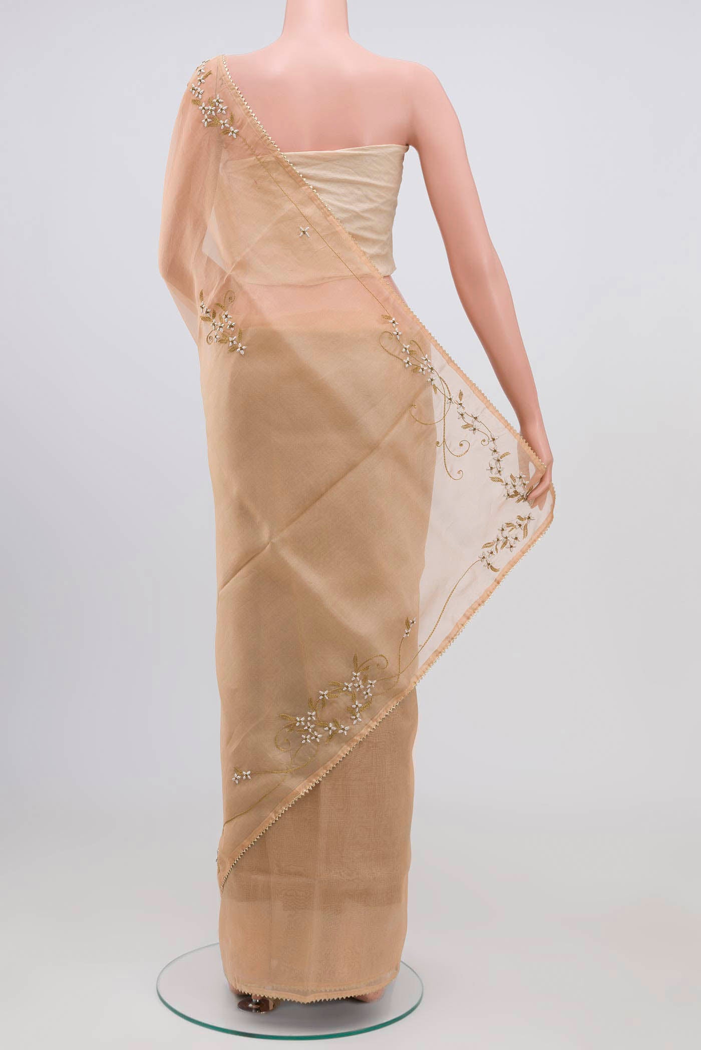 Pleats and pallu of Sandal Organza Silk Saree with Plain Body and Embroidery Border