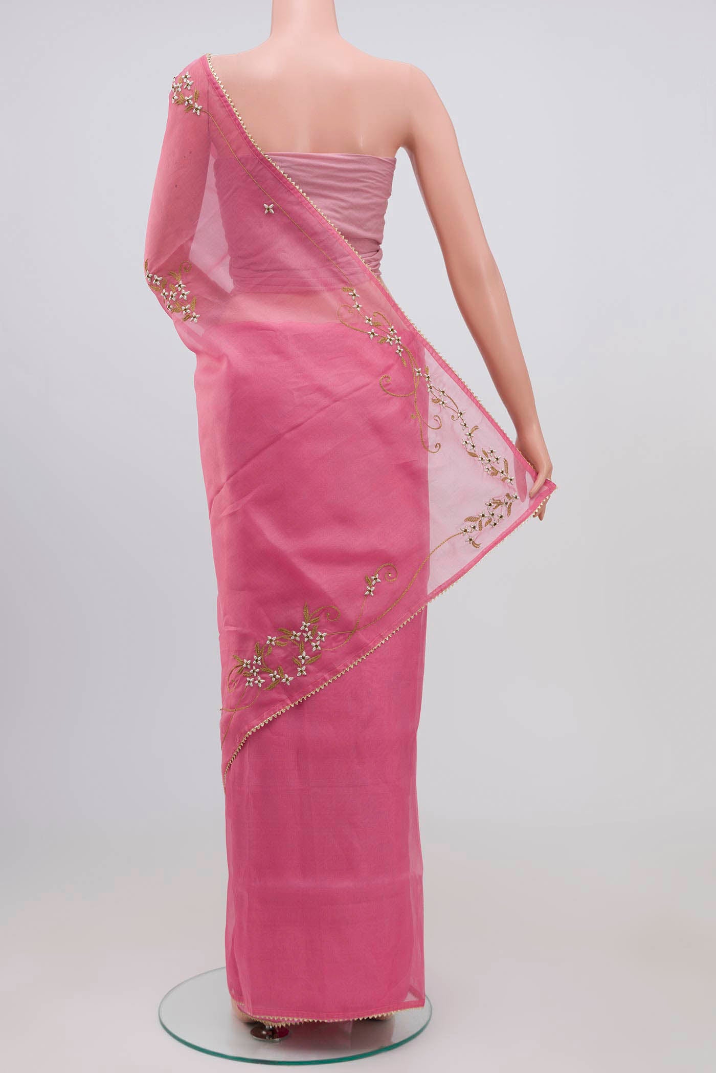 Pleats and pallu of Pink Organza Silk Saree with Plain Body and Embroidery Border