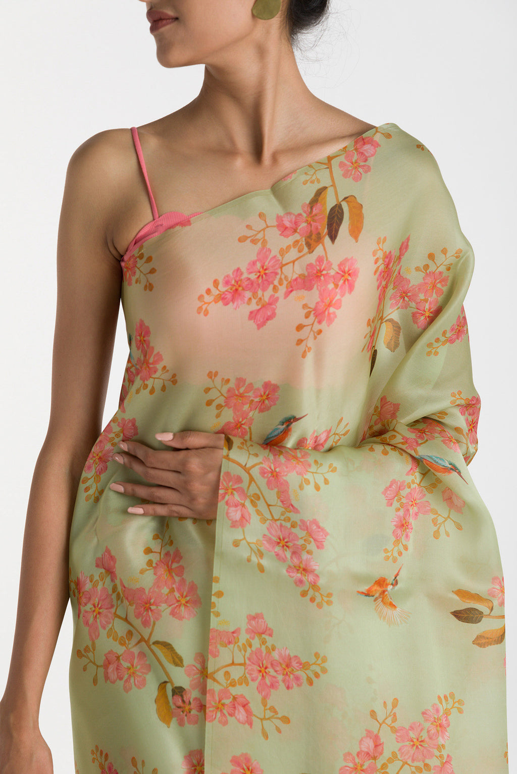 Close up of Green Satin Organza Saree with Bird Print on the body and Without Border displaying folds