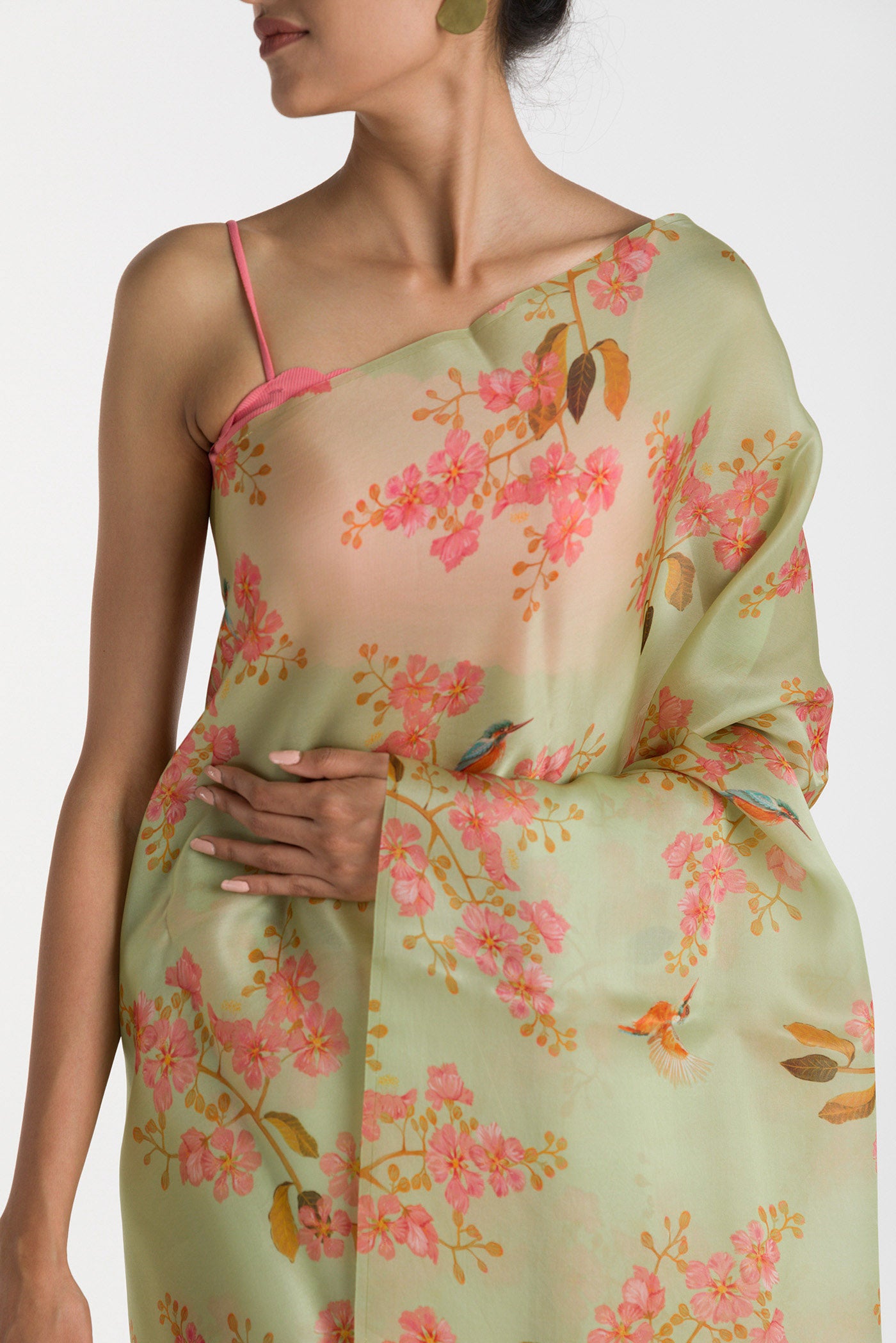 Close up of Green Satin Organza Saree with Bird Print on the body and Without Border displaying folds