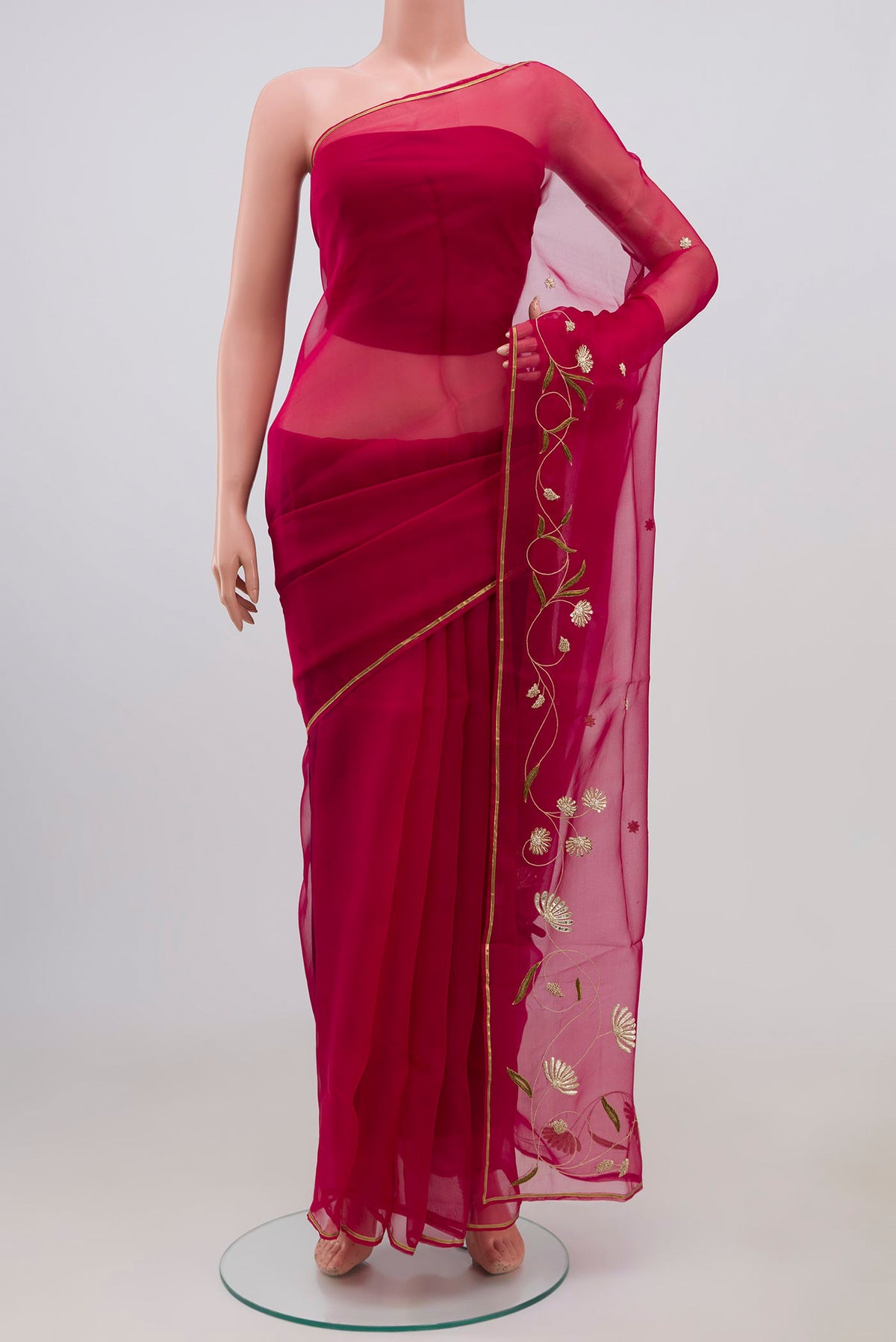 Pink Organza Silk Saree with Embroidery on the body and Embroidery Border displayed on a mannequin