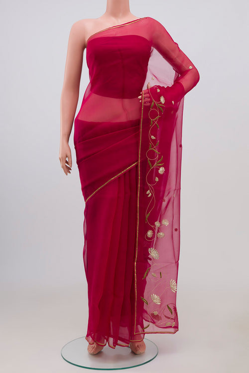 Pink Organza Silk Saree with Embroidery on the body and Embroidery Border displayed on a mannequin