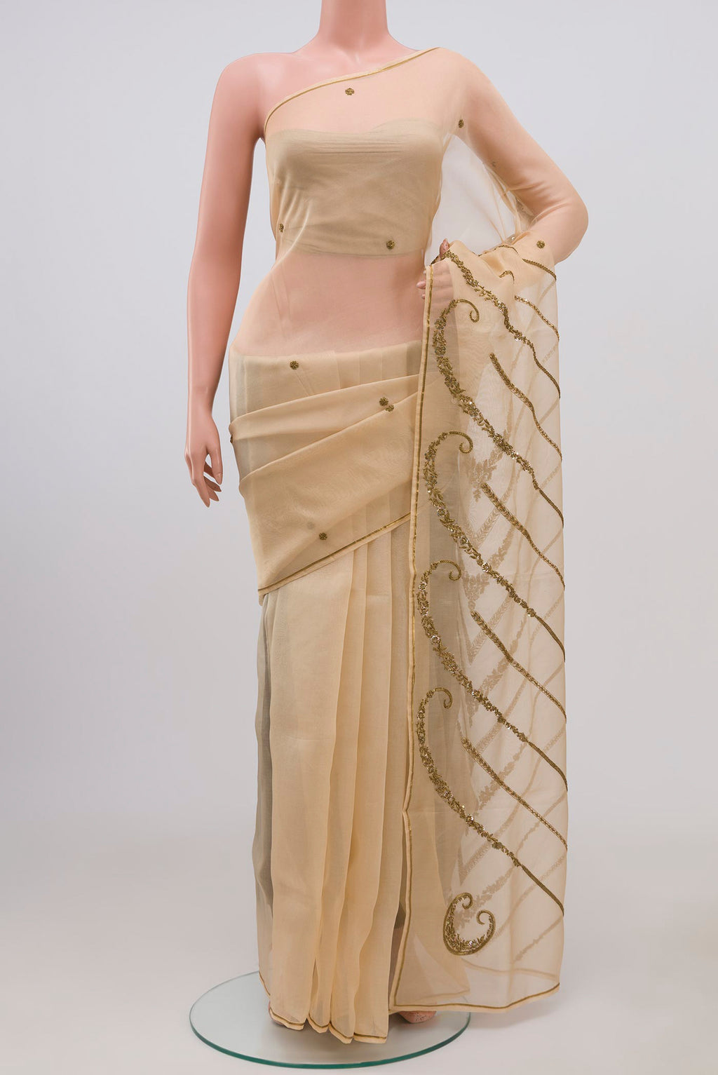 Beige Organza Silk Saree with Embroidery on the body and Embroidery Border displayed on a mannequin