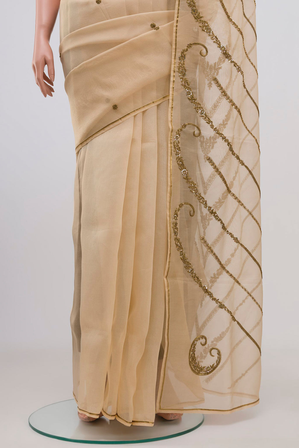 Pleats and pallu of Beige Organza Silk Saree with Embroidery on the body and Embroidery Border