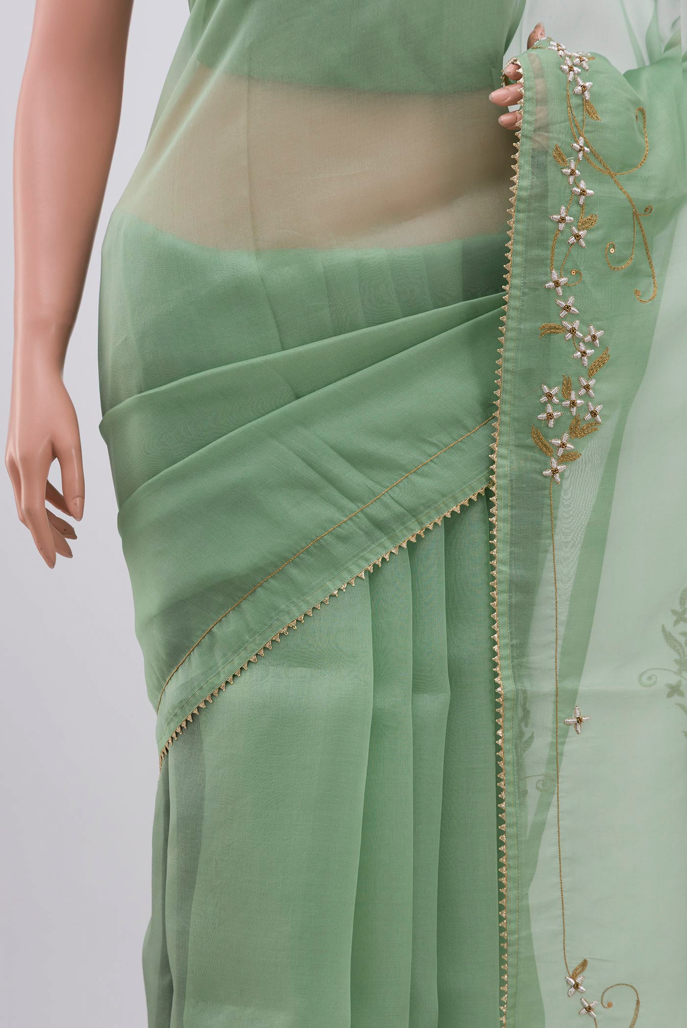 Border image of Green Organza Silk Saree with Embroidery on the body and Embroidery Border