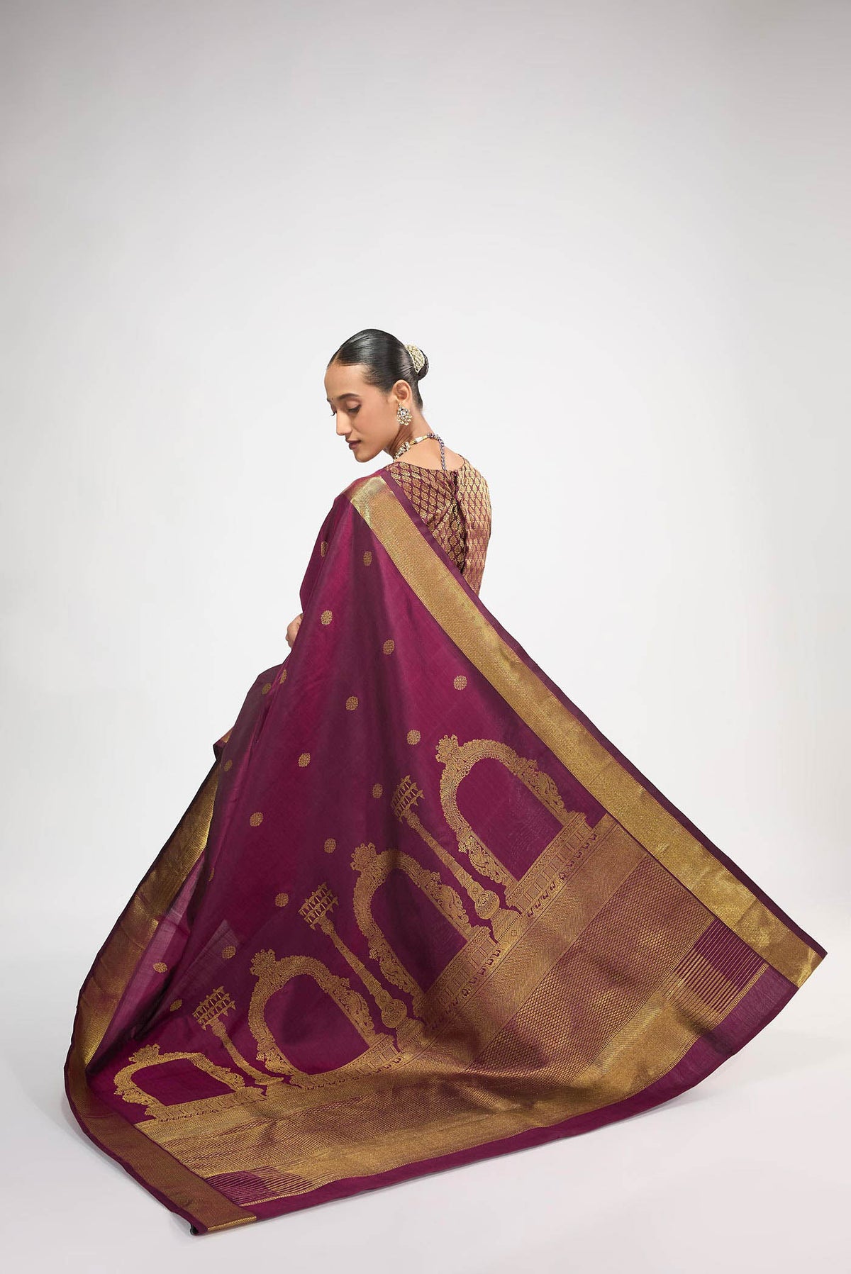 Close up image of the blouse of Pure Silk Pure Zari Maroon Kanchipuram Saree with Zari Butta on the body and Zari Border