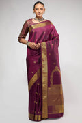 Pure Silk Pure Zari Maroon Kanchipuram Saree with Zari Butta on the body and Zari Border displayed on a mannequin