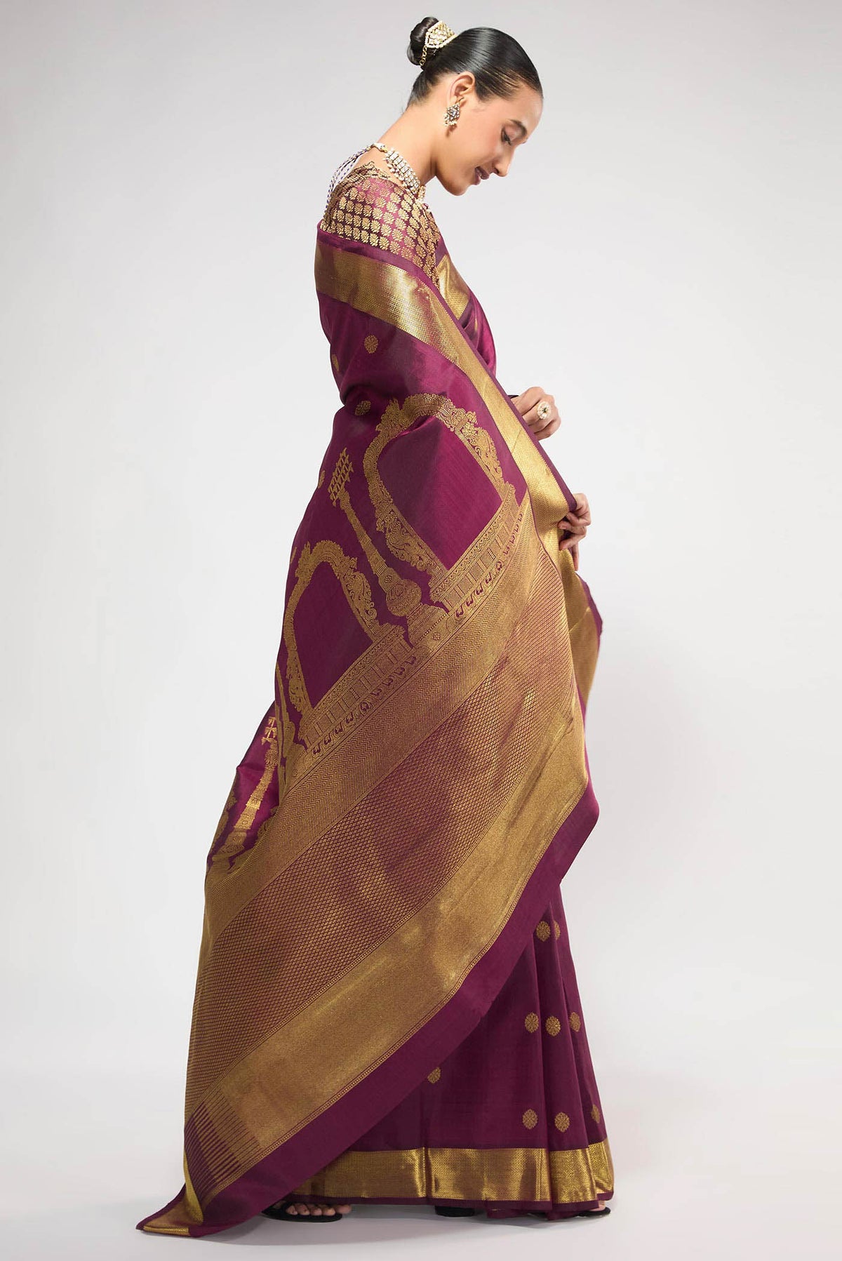 Close up image of the pallu of Pure Silk Pure Zari Maroon Kanchipuram Saree with Zari Butta on the body and Zari Border