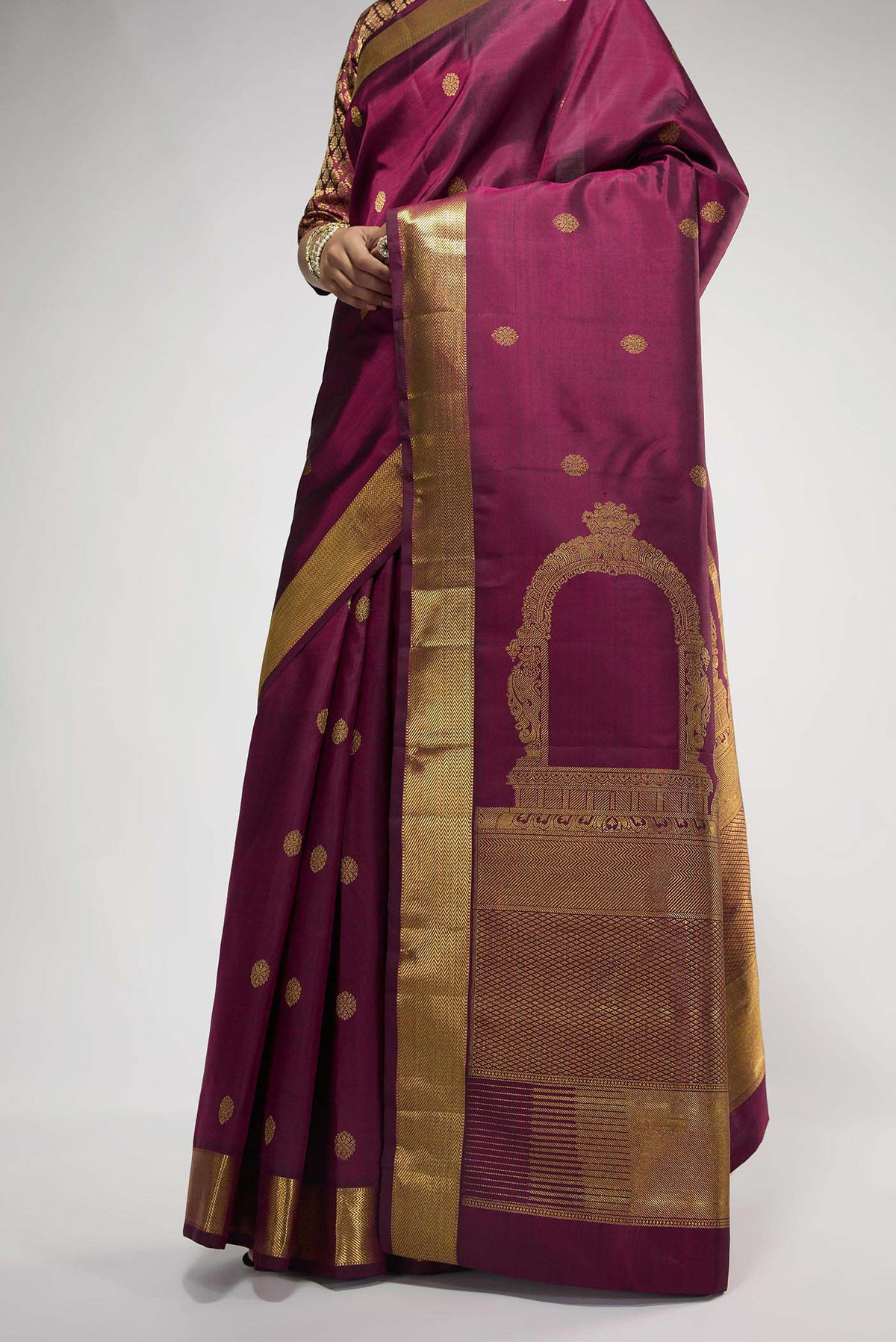 Flat view of Pure Silk Pure Zari Maroon Kanchipuram Saree with Zari Butta on the body and Zari Border