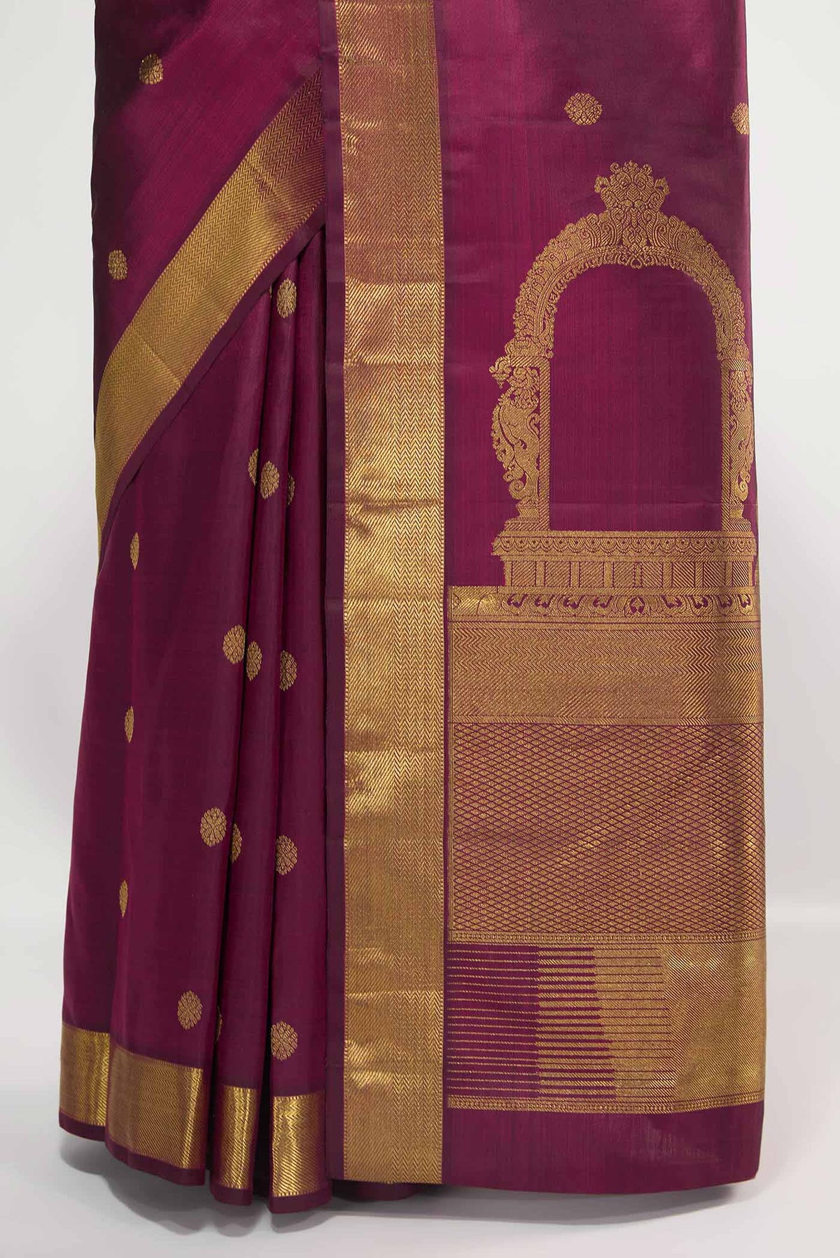 Pleats and pallu of Pure Silk Pure Zari Maroon Kanchipuram Saree with Zari Butta on the body and Zari Border