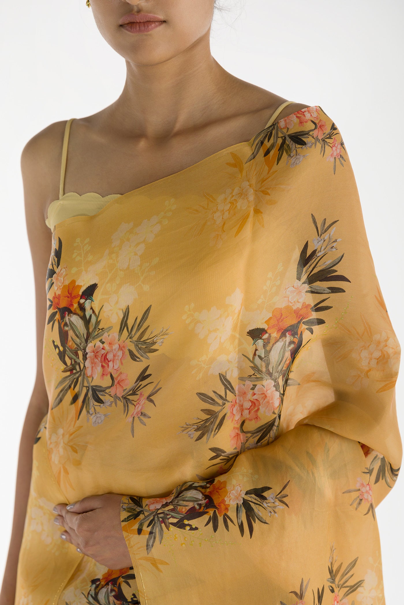 Close up of Yellow Satin Organza Saree with Bird Print on the body and Without Border displaying folds