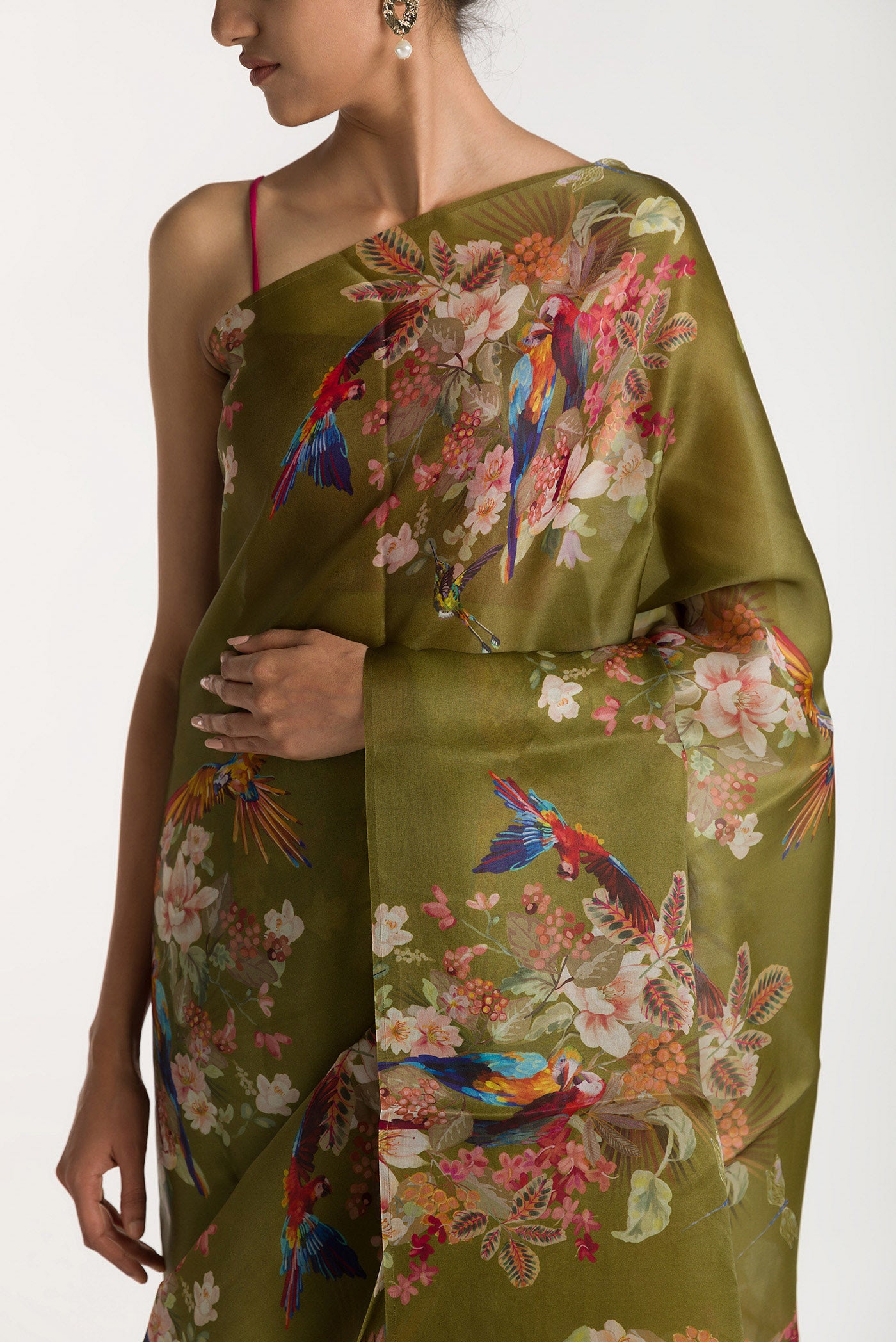 Close up of Olive Green Satin Organza Saree with Bird Print on the body and Without Border displaying folds