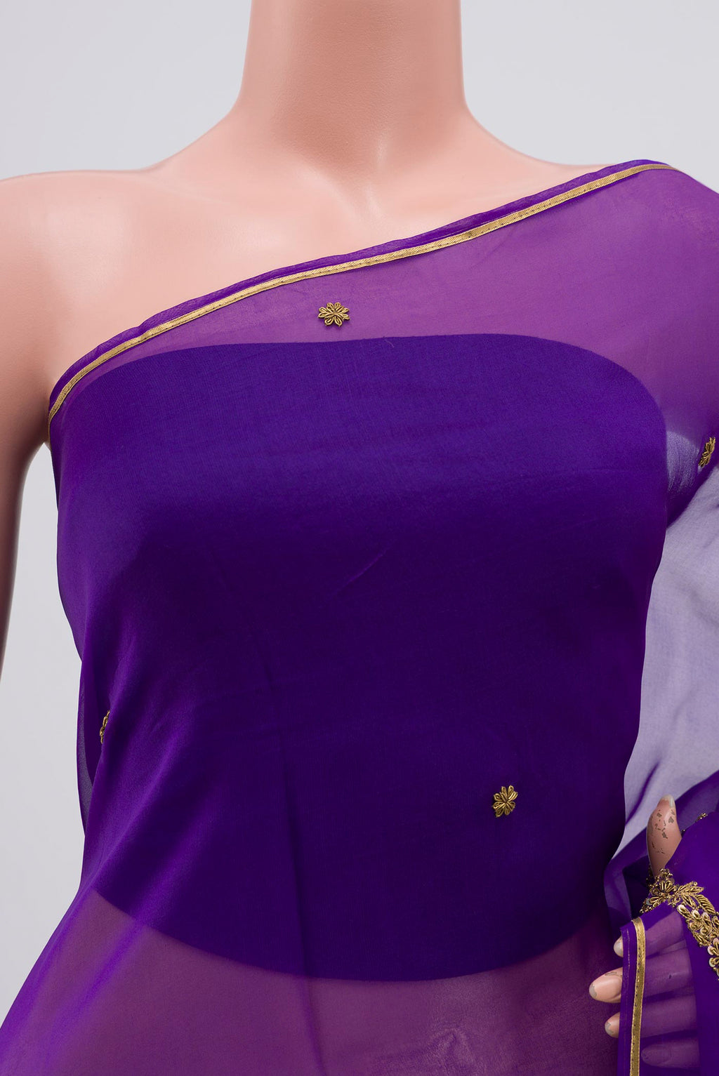 Close up of Violet Organza Silk Saree with Embroidery on the body and Embroidery Border displaying folds