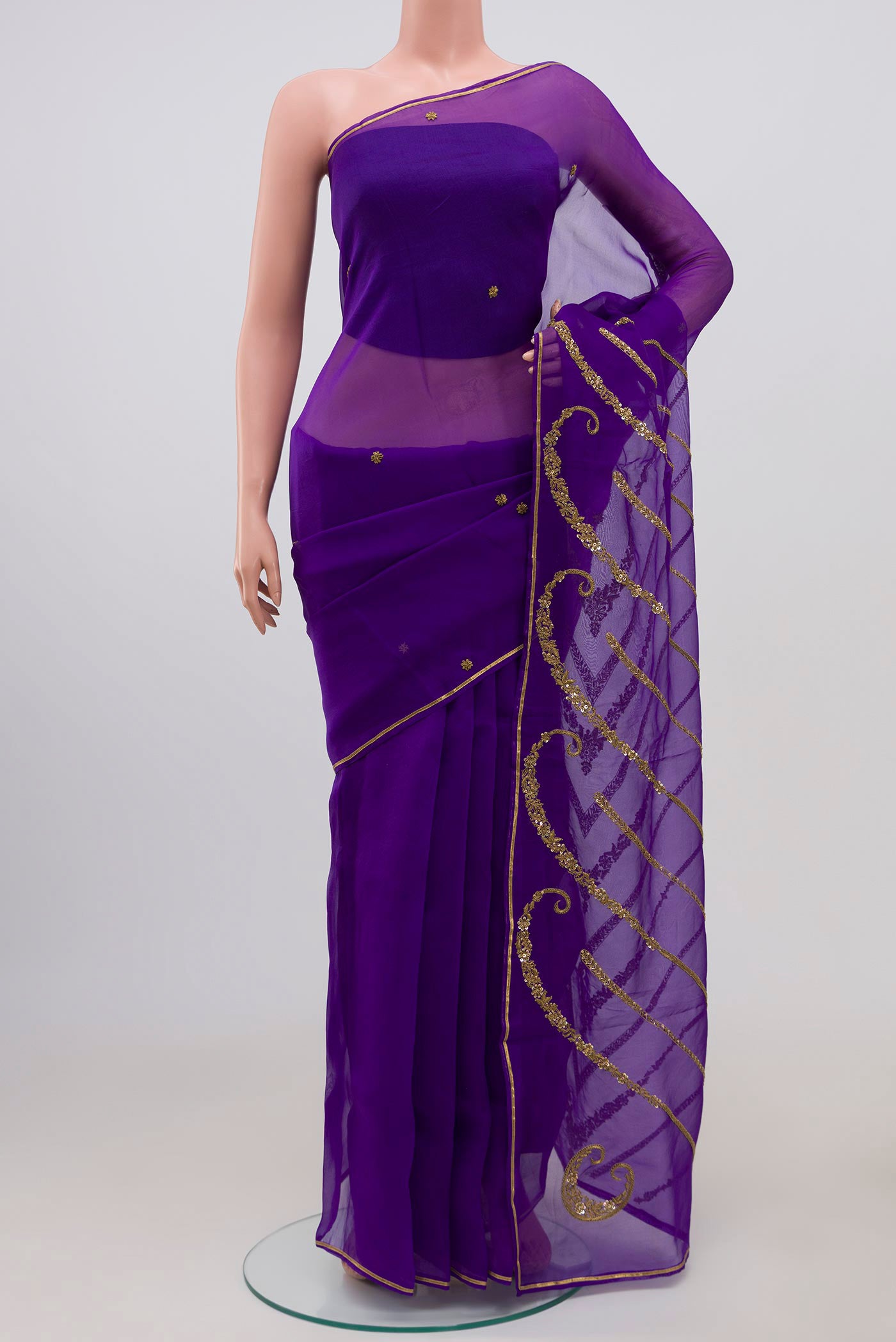 Violet Organza Silk Saree with Embroidery on the body and Embroidery Border displayed on a mannequin