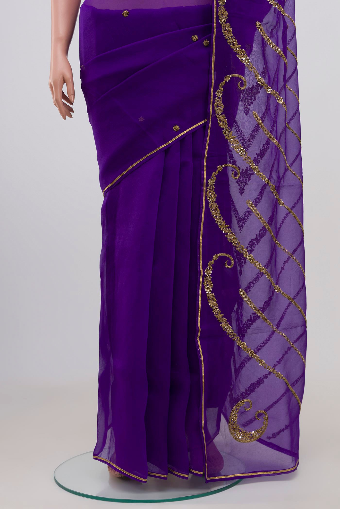 Pleats and pallu of Violet Organza Silk Saree with Embroidery on the body and Embroidery Border