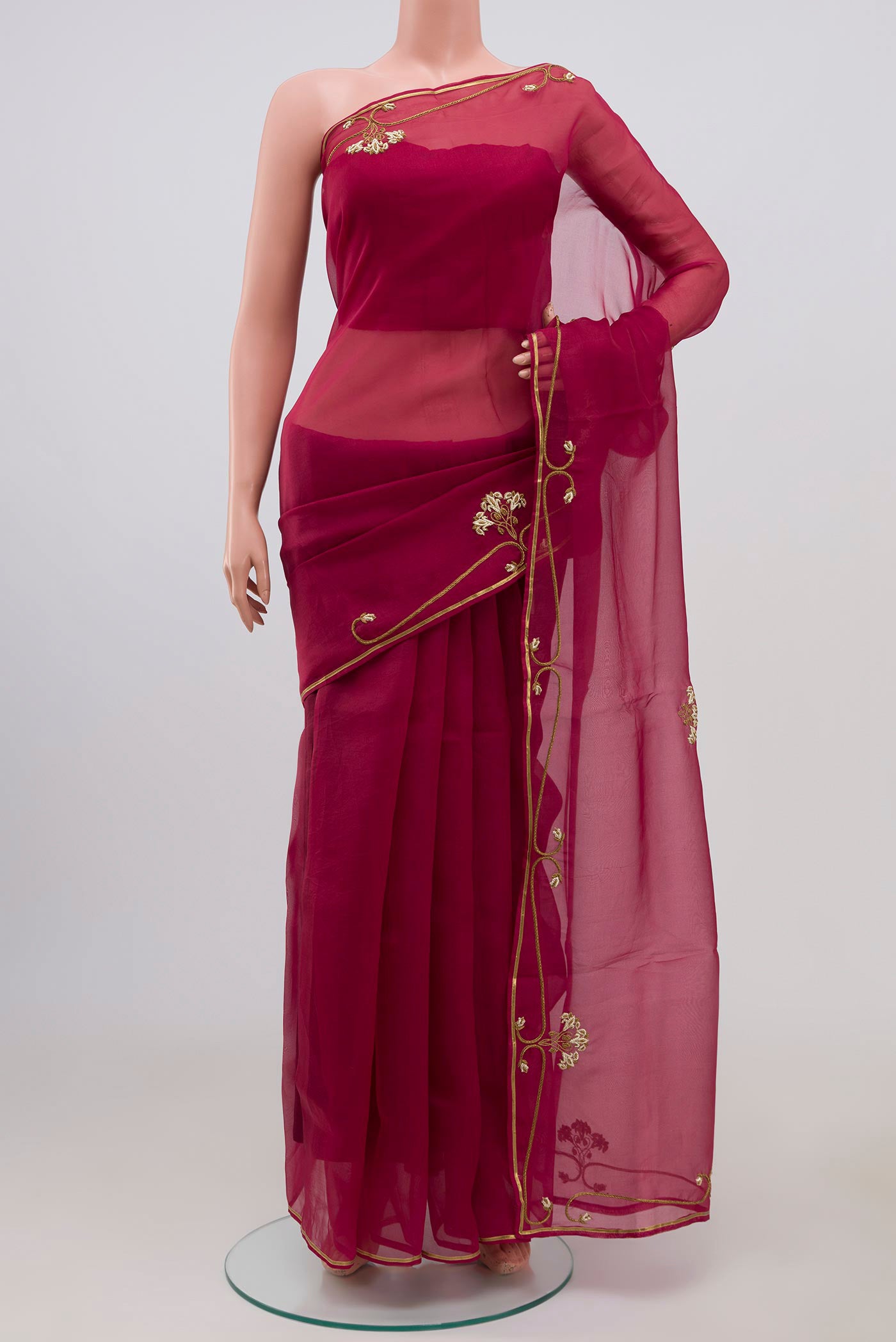 Maroon Organza Silk Saree with Embroidery on the body and Embroidery Border displayed on a mannequin