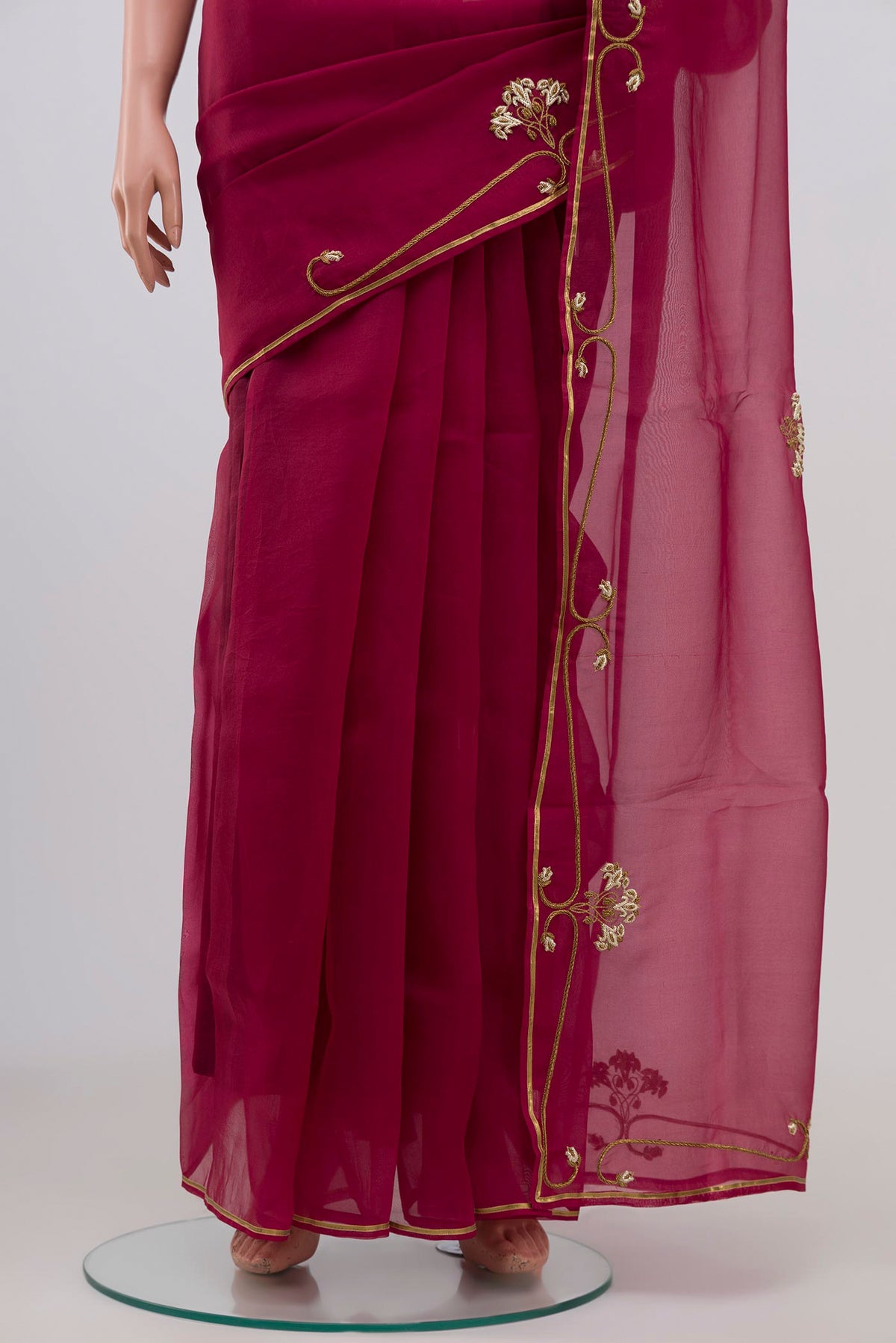 Pleats and pallu of Maroon Organza Silk Saree with Embroidery on the body and Embroidery Border