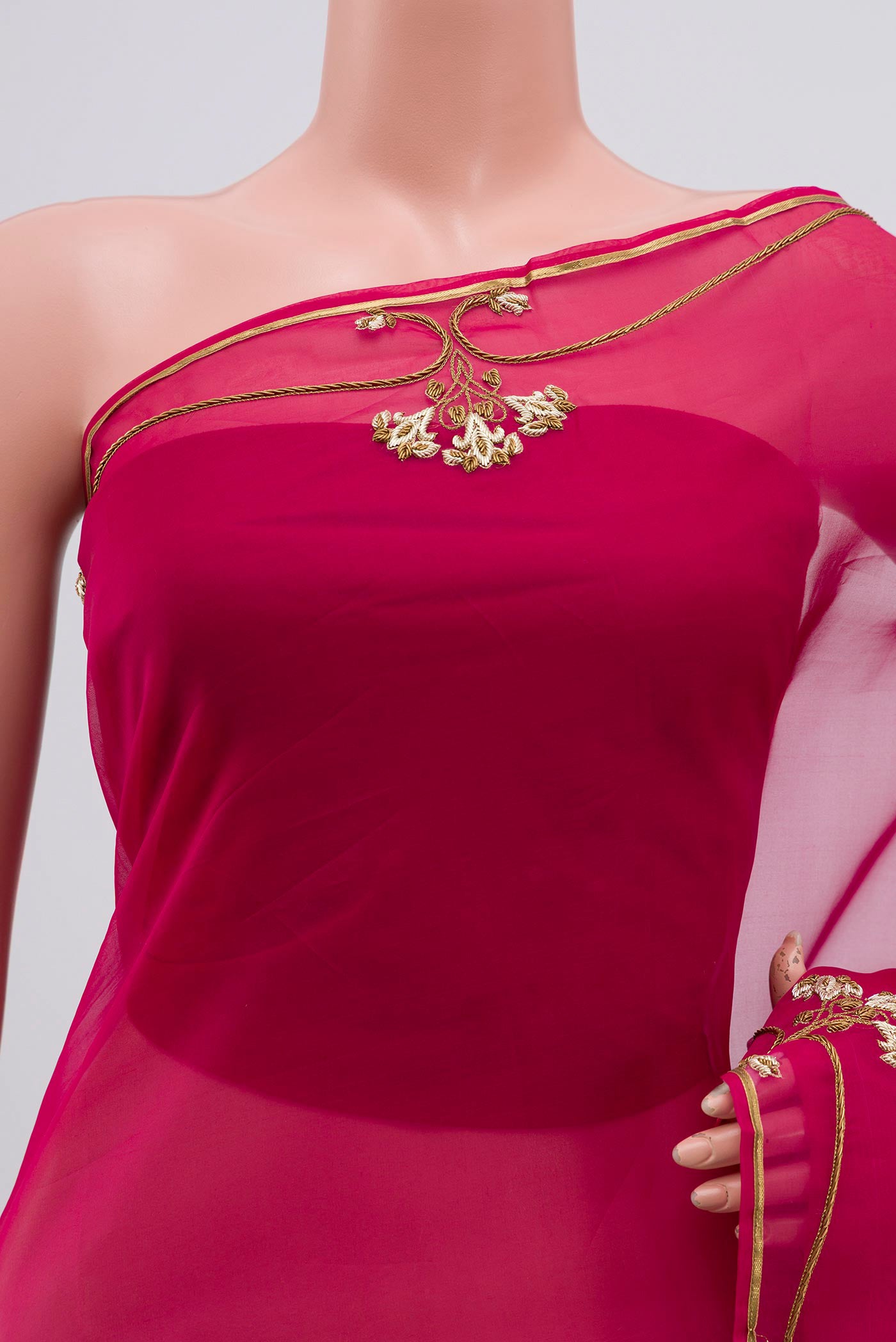 Close up of Pink Organza Silk Saree with Embroidery on the body and Embroidery Border displaying folds