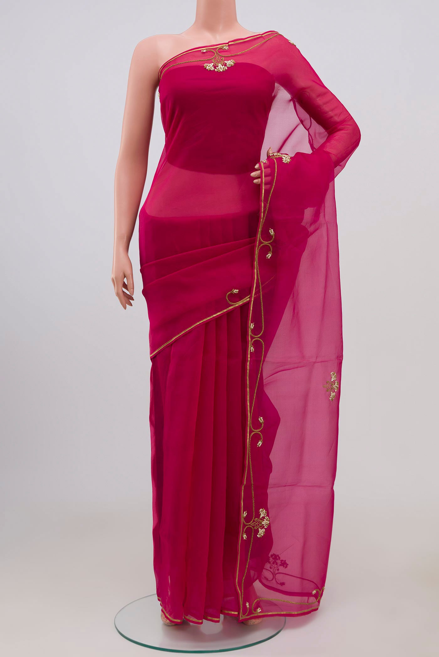 Pink Organza Silk Saree with Embroidery on the body and Embroidery Border displayed on a mannequin