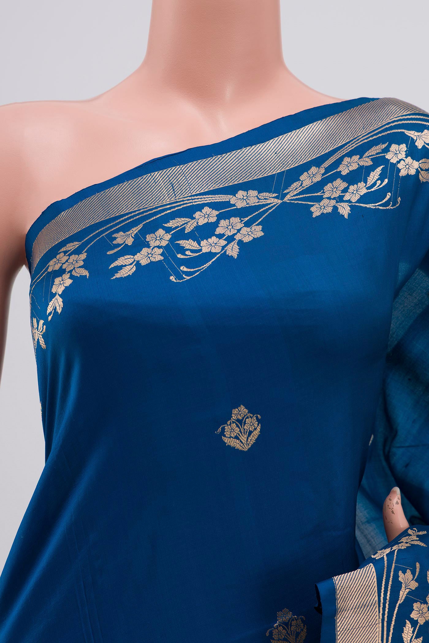 Close up of Blue Banarasi Katan Silk Saree with Zari Butta on the body and Zari Border displaying folds