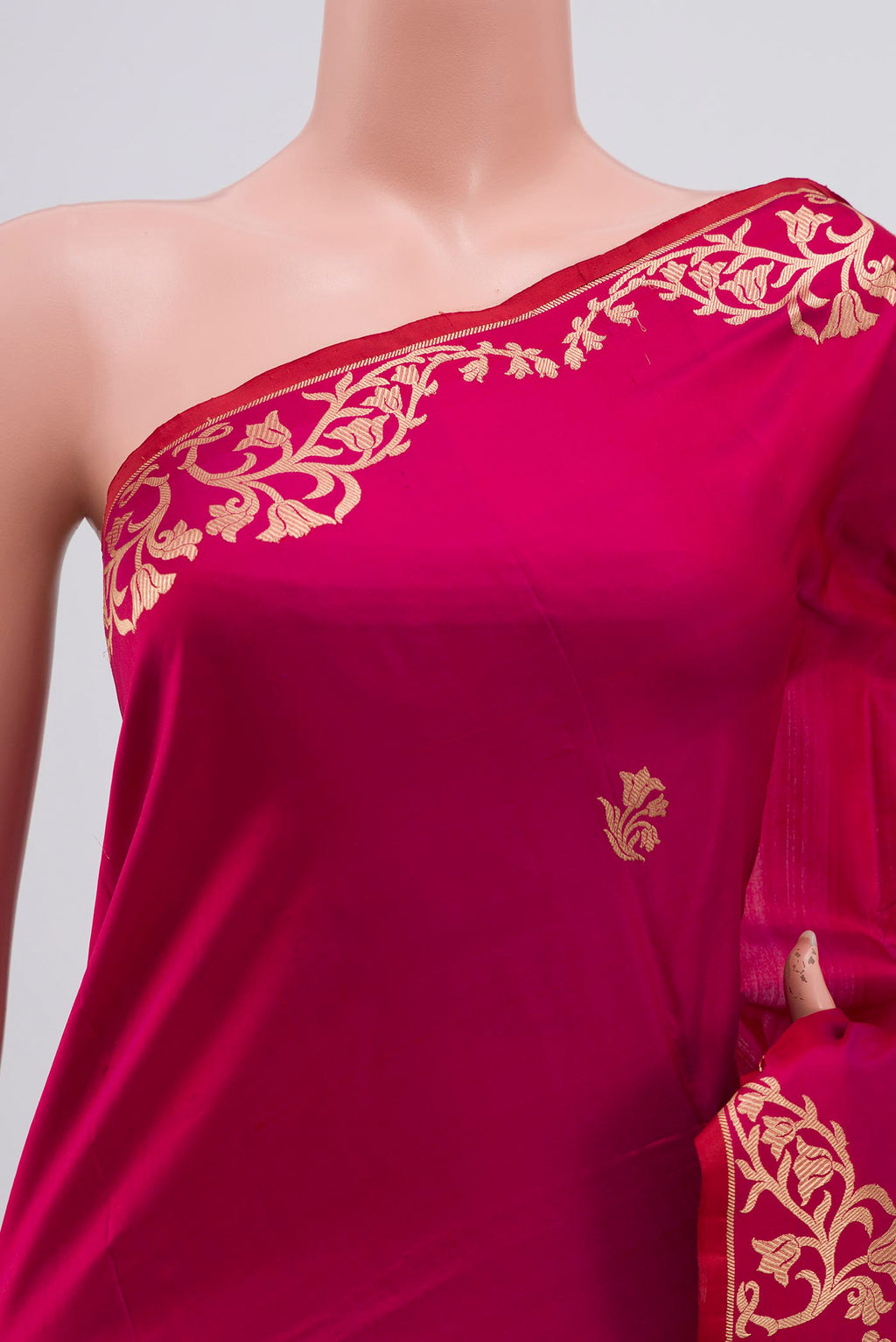 Close up of Magenta Banarasi Katan Silk Saree with Zari Butta on the body and Zari Border displaying folds