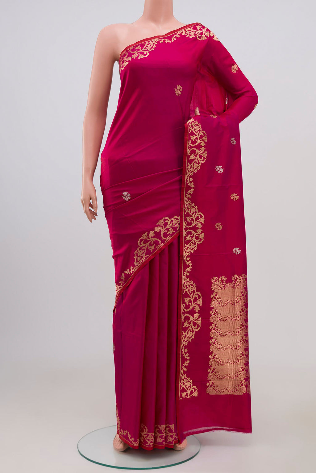 Magenta Banarasi Katan Silk Saree with Zari Butta on the body and Zari Border displayed on a mannequin