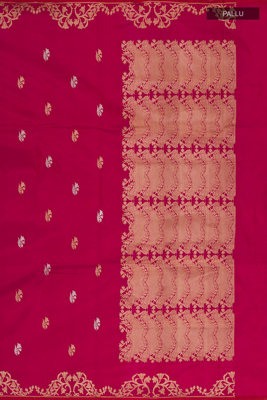 Close up image of the pallu of Magenta Banarasi Katan Silk Saree with Zari Butta on the body and Zari Border