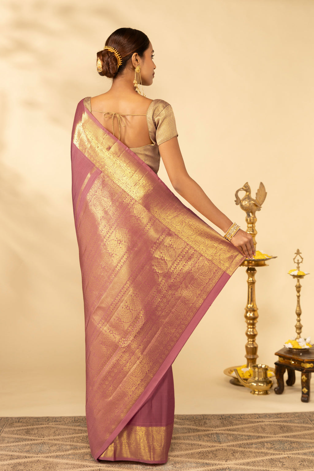Close up image of the pallu of Coral Kanchipuram Silk Saree with Checked design on the body and Zari Border