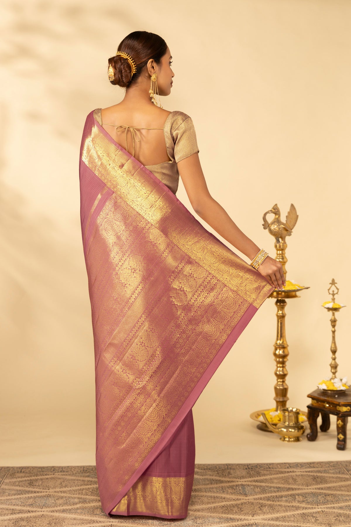 Close up image of the pallu of Coral Kanchipuram Silk Saree with Checked design on the body and Zari Border