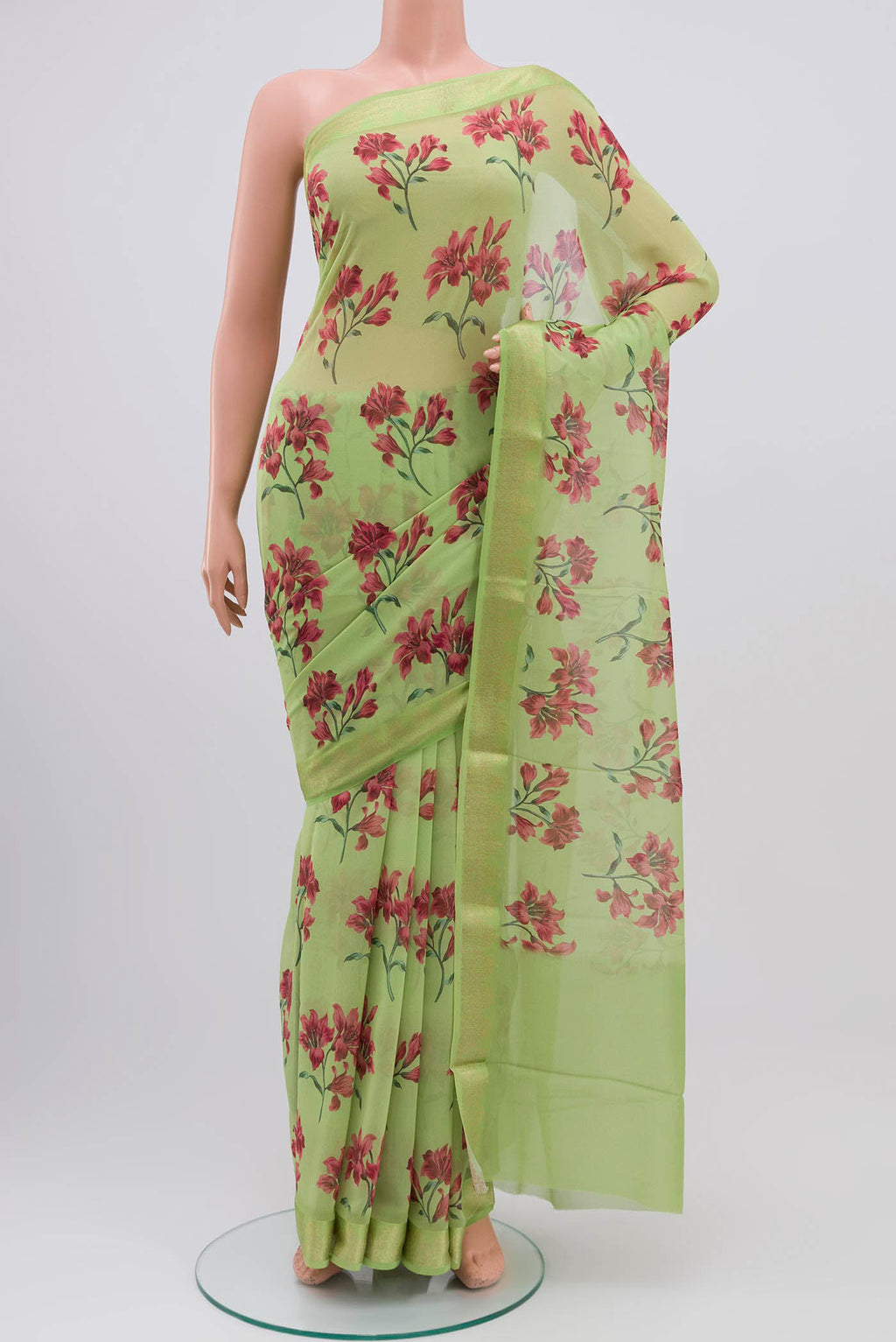 Light Green Mysore Chiffon Saree with Printed design on the body and Zari Border displayed on a mannequin