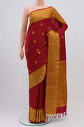 Maroon Kanchipuram Silk Saree with Thread Butta on the body and Thread Border displayed on a mannequin