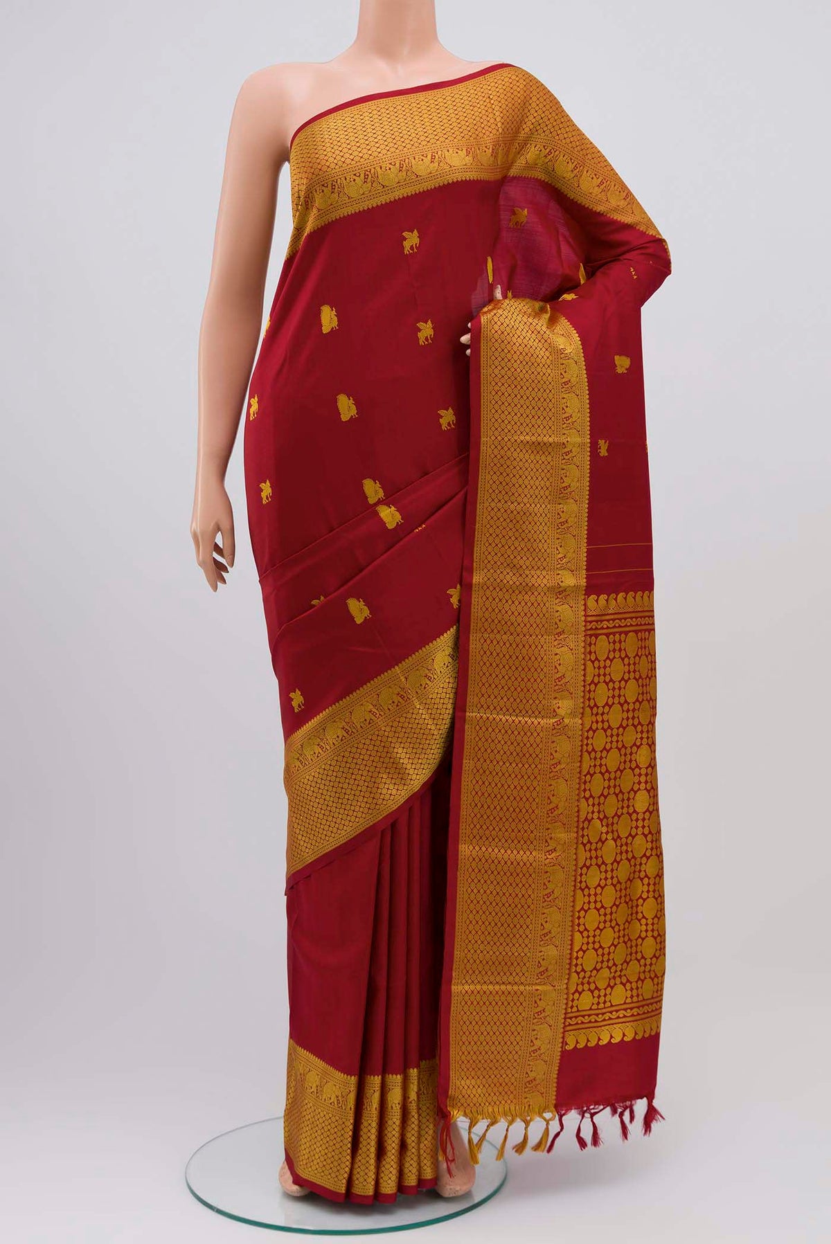 Maroon Kanchipuram Silk Saree with Thread Butta on the body and Thread Border displayed on a mannequin