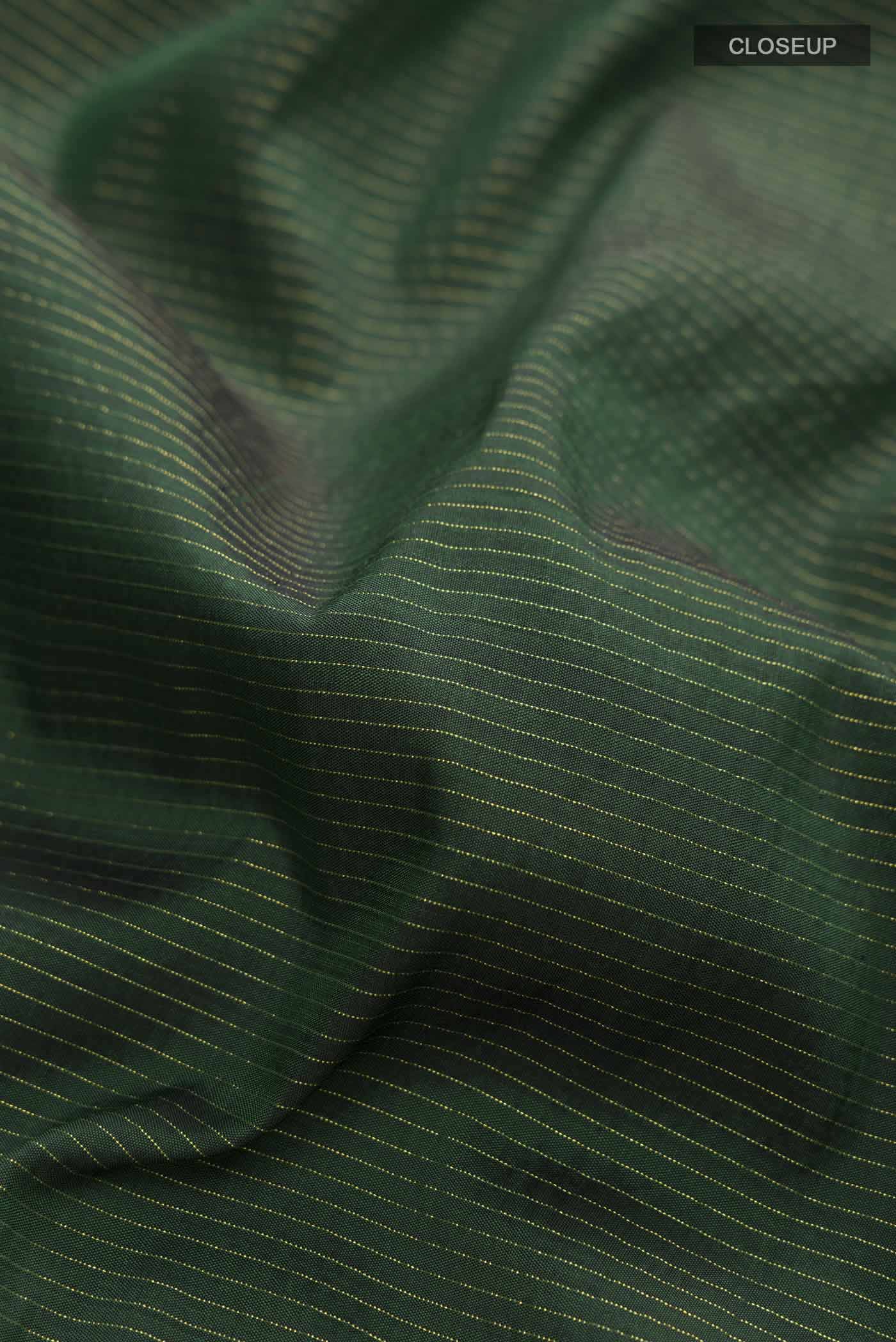 Close up of Pure Silk Pure Zari Green Kanchipuram Nine Yards Saree with Stripes on the body and Zari Border displaying folds