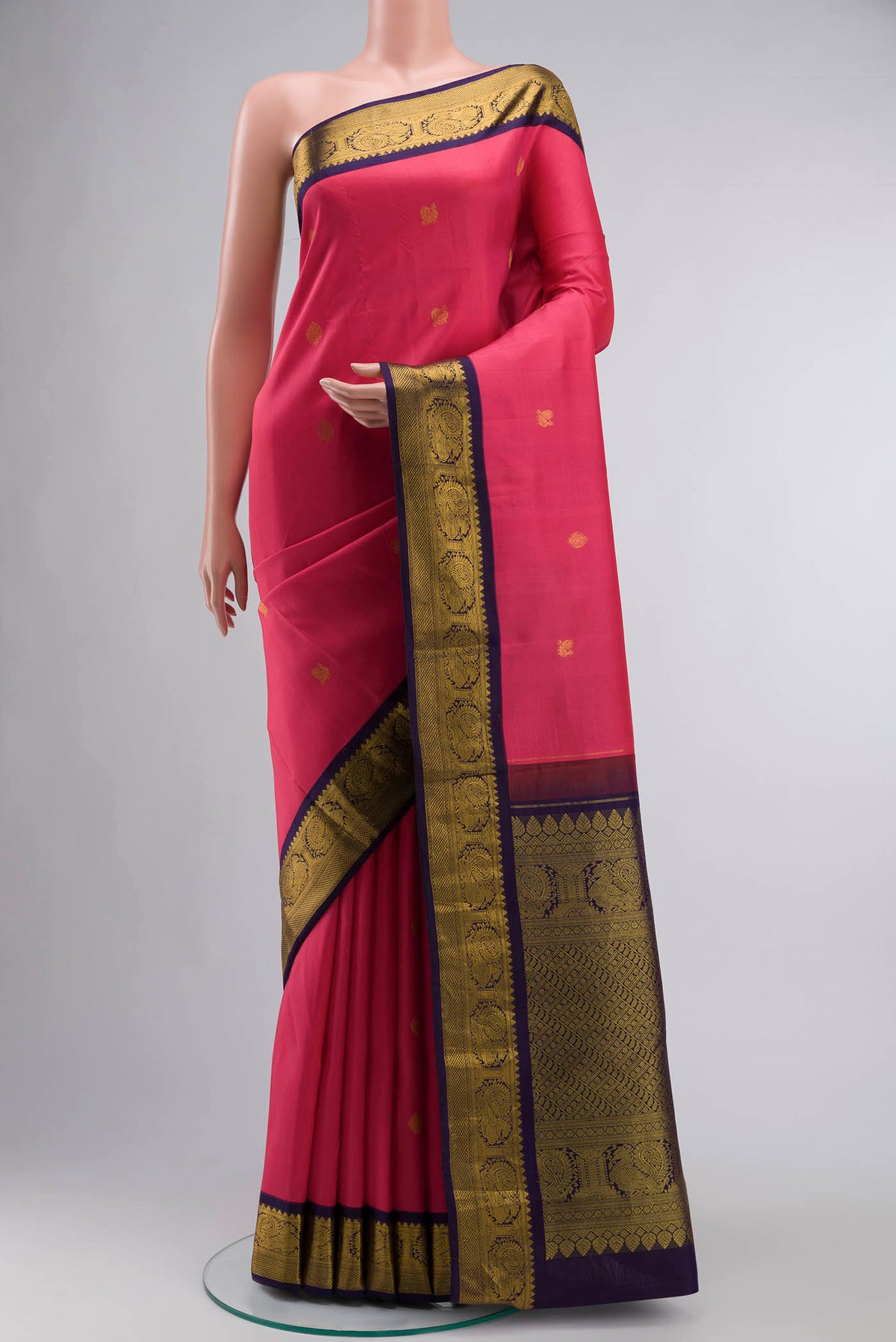 Pink Kanchipuram Silk Saree with Zari Butta on the body and Zari Border displayed on a mannequin
