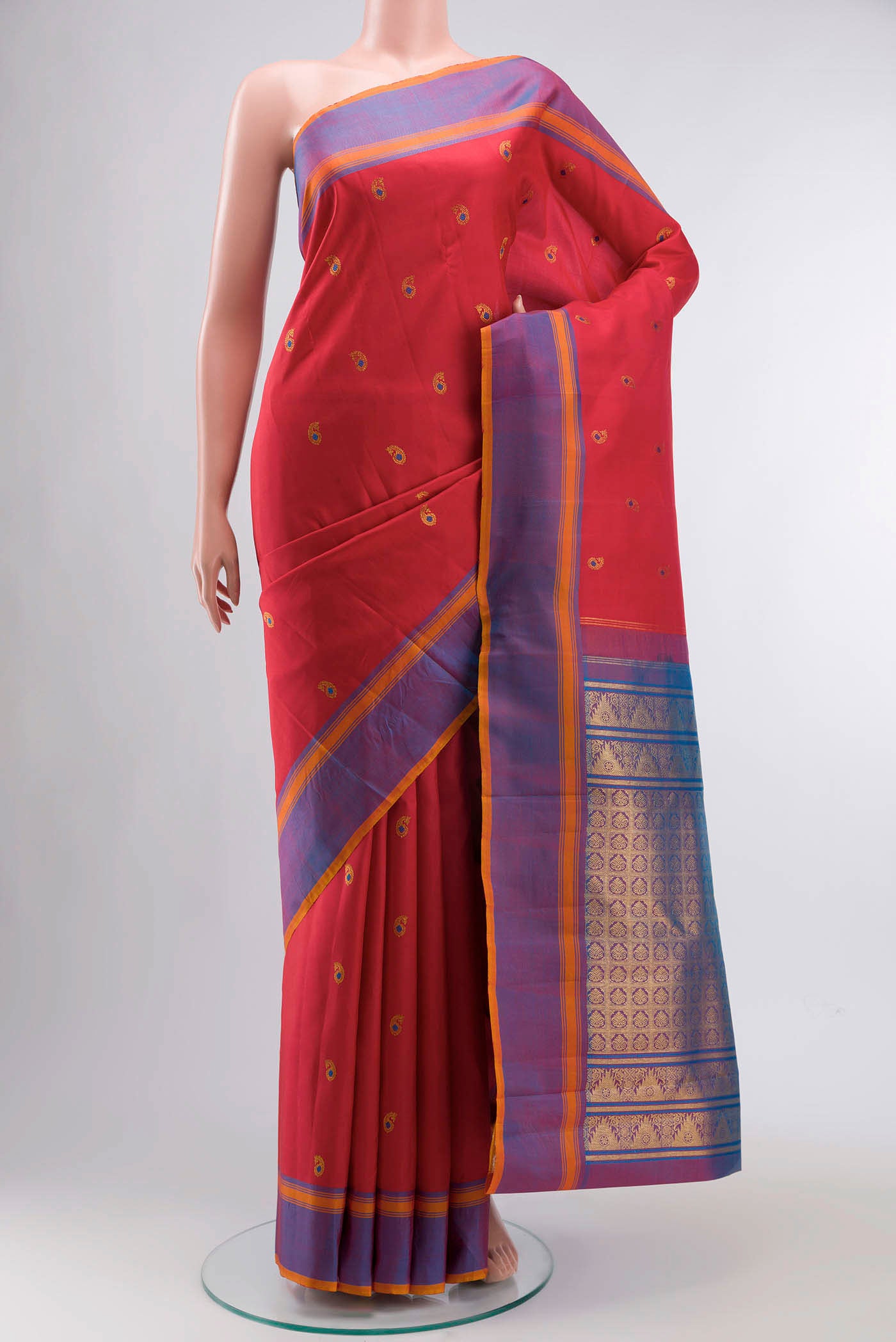 Red Kanchipuram Silk Saree with Zari Butta on the body and Plain Border displayed on a mannequin