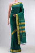 Green Kanchipuram Silk Nine Yards Saree with Plain Body and Zari Border displayed on a mannequin