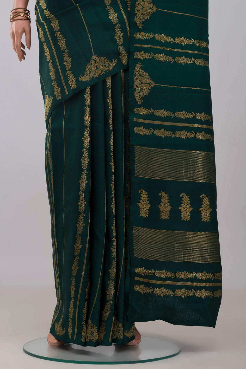 Pleats and pallu of Pure Silk Pure Zari Bottle Green Kanjivaram Saree with Stripes on the body and Without Border. 