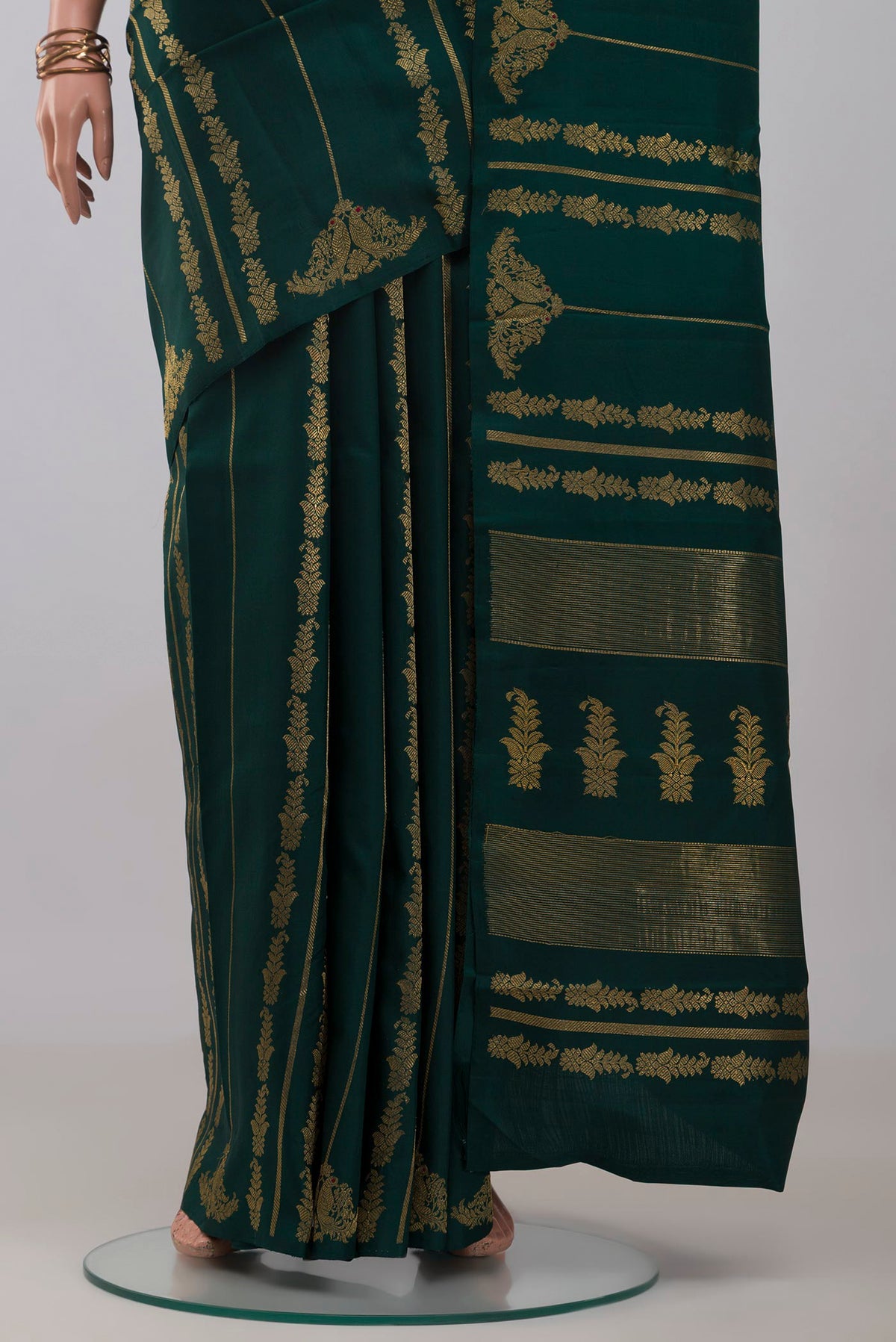 Pleats and pallu of Pure Silk Pure Zari Bottle Green Kanjivaram Saree with Stripes on the body and Without Border. 